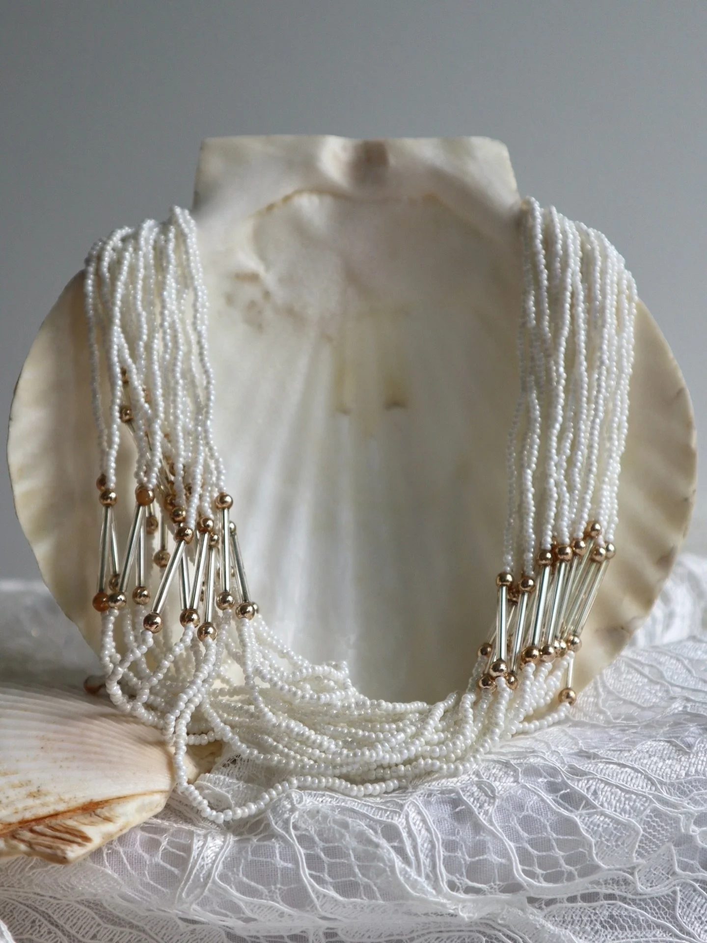 The Winner Takes It All necklace has sold today in store at @collected.vintage.studio 
🤍🤍🤍🤍🤍🤍
This 1970s dream is made of fine white seed beads with gold tone bar beads and a gorgeous floral clasp. 
We&rsquo;d style her with white vintage flare