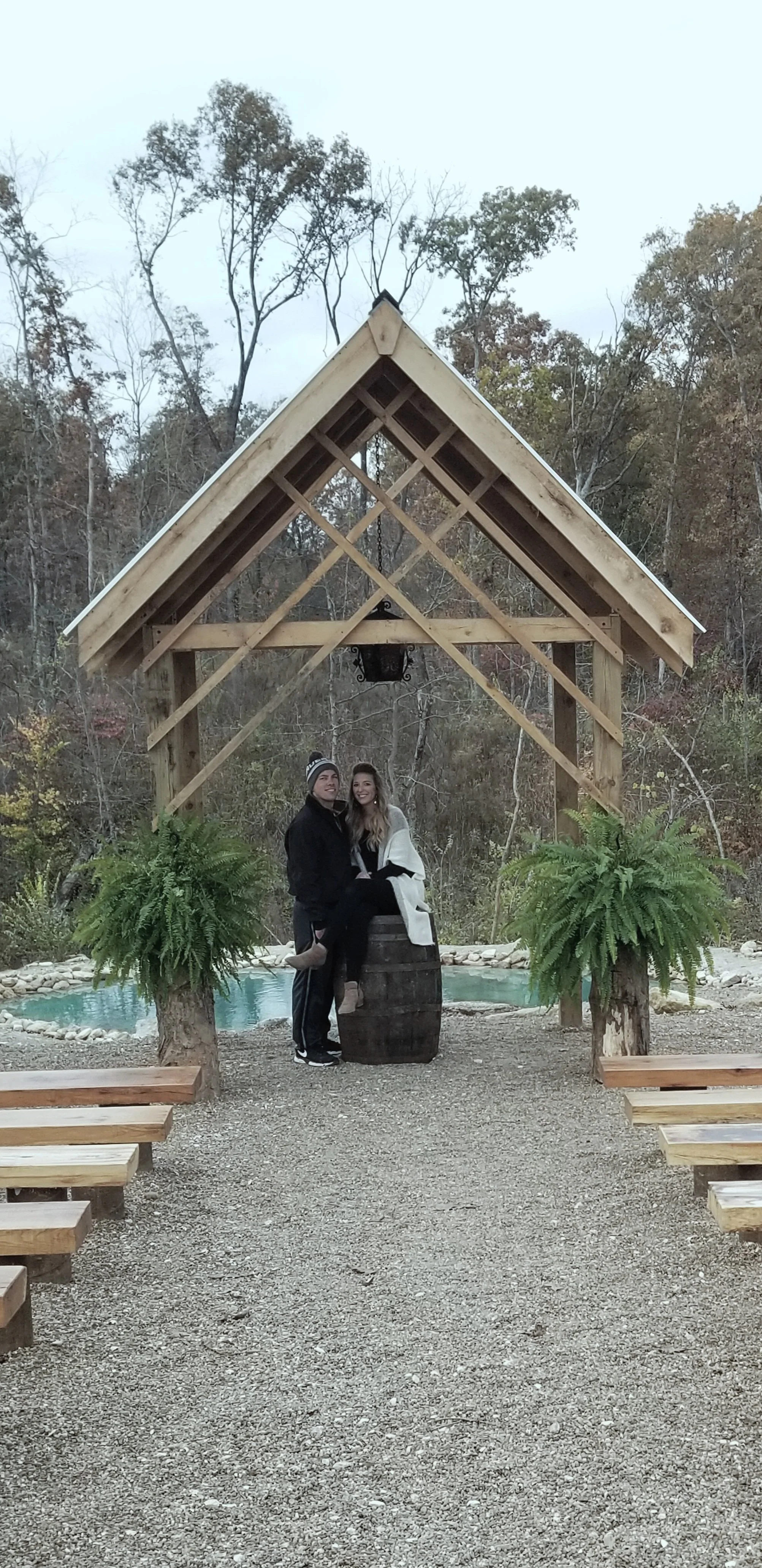 Couple at the hand-built outdoor chapel at Chanting Oak Ridge wedding venue in Wright City, MO
