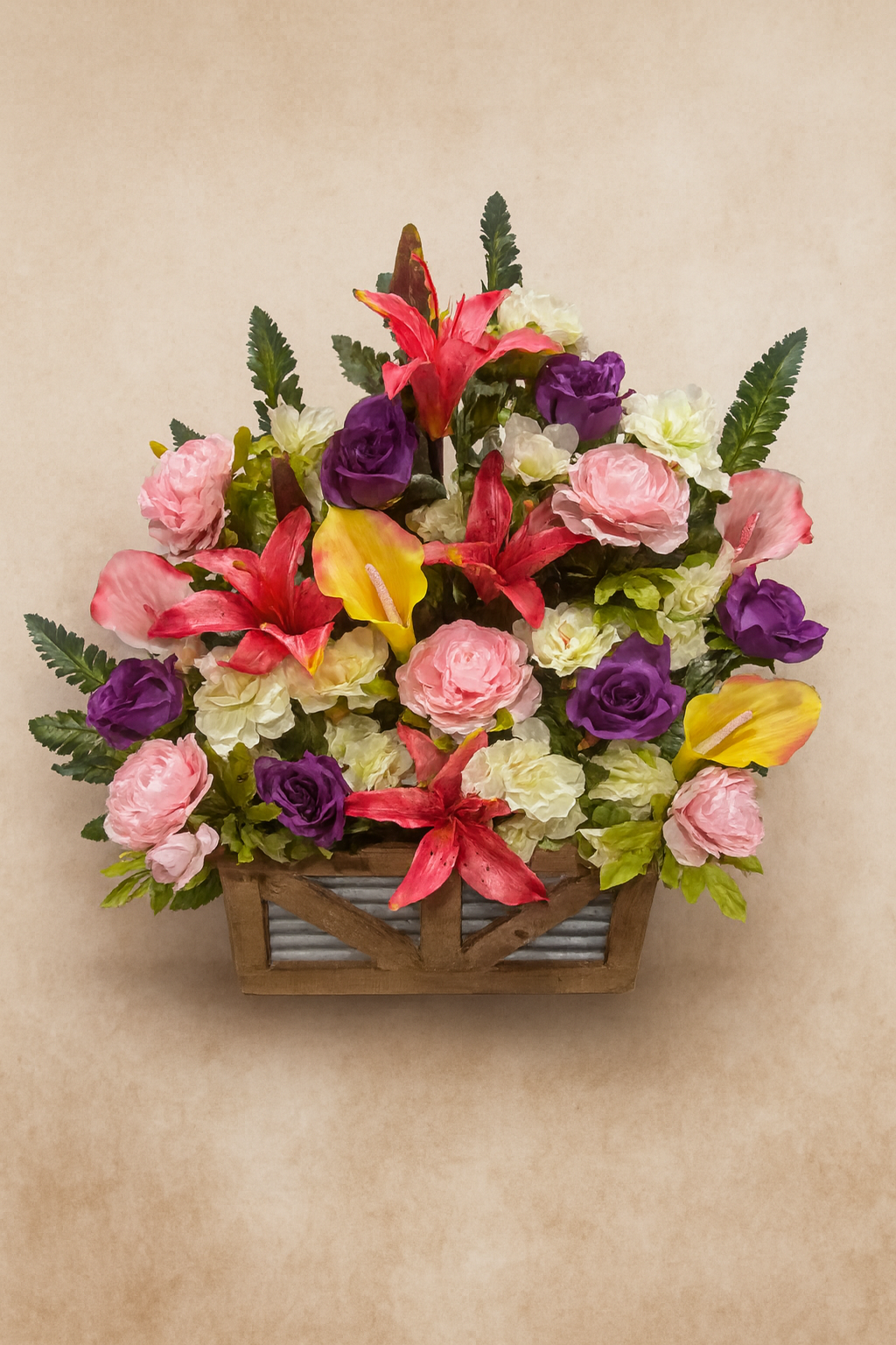 Colorful flower arrangement with pink, purple, red, and yellow flowers in a wooden basket.