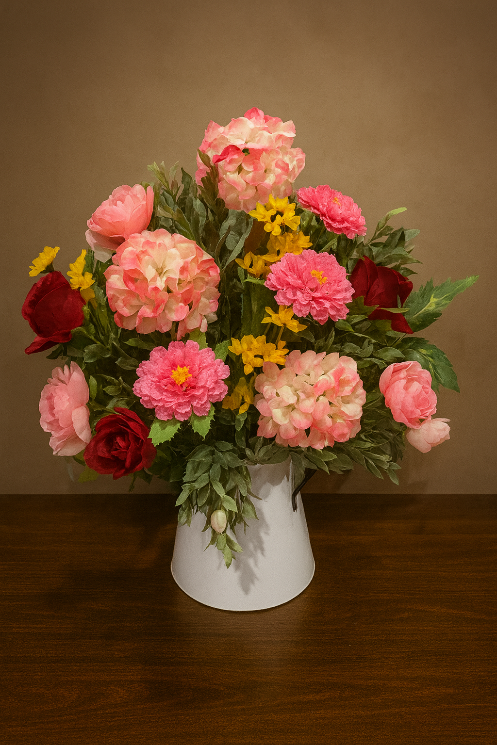 A vibrant seasonal mix of soft pink peonies, blush hydrangeas, and garden roses accented with delicate yellow blooms. This arrangement brings a fresh, romantic feel to any space -- Perfect for spring gifting or home decor. 