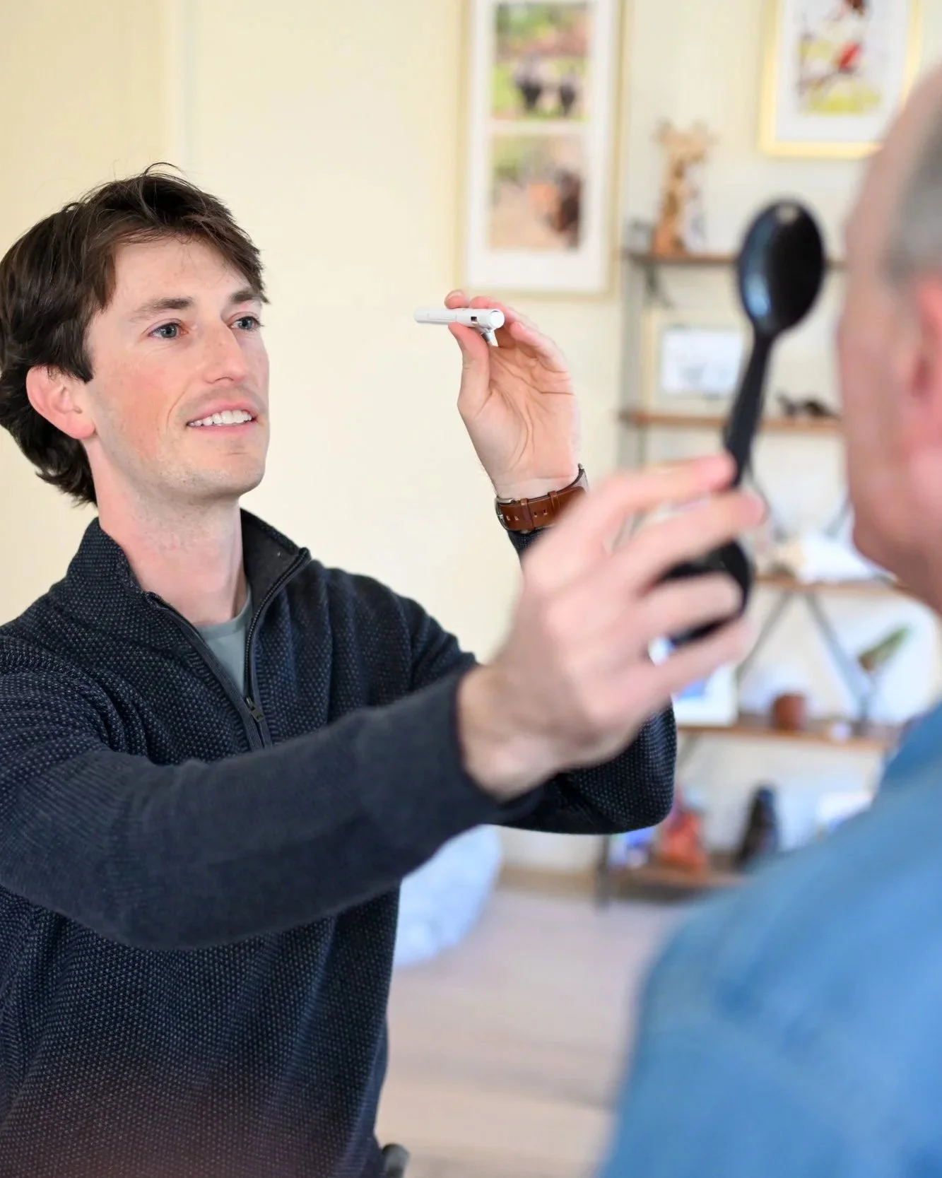 Justin Martin performing an in-home evaluation on a patient with dizziness