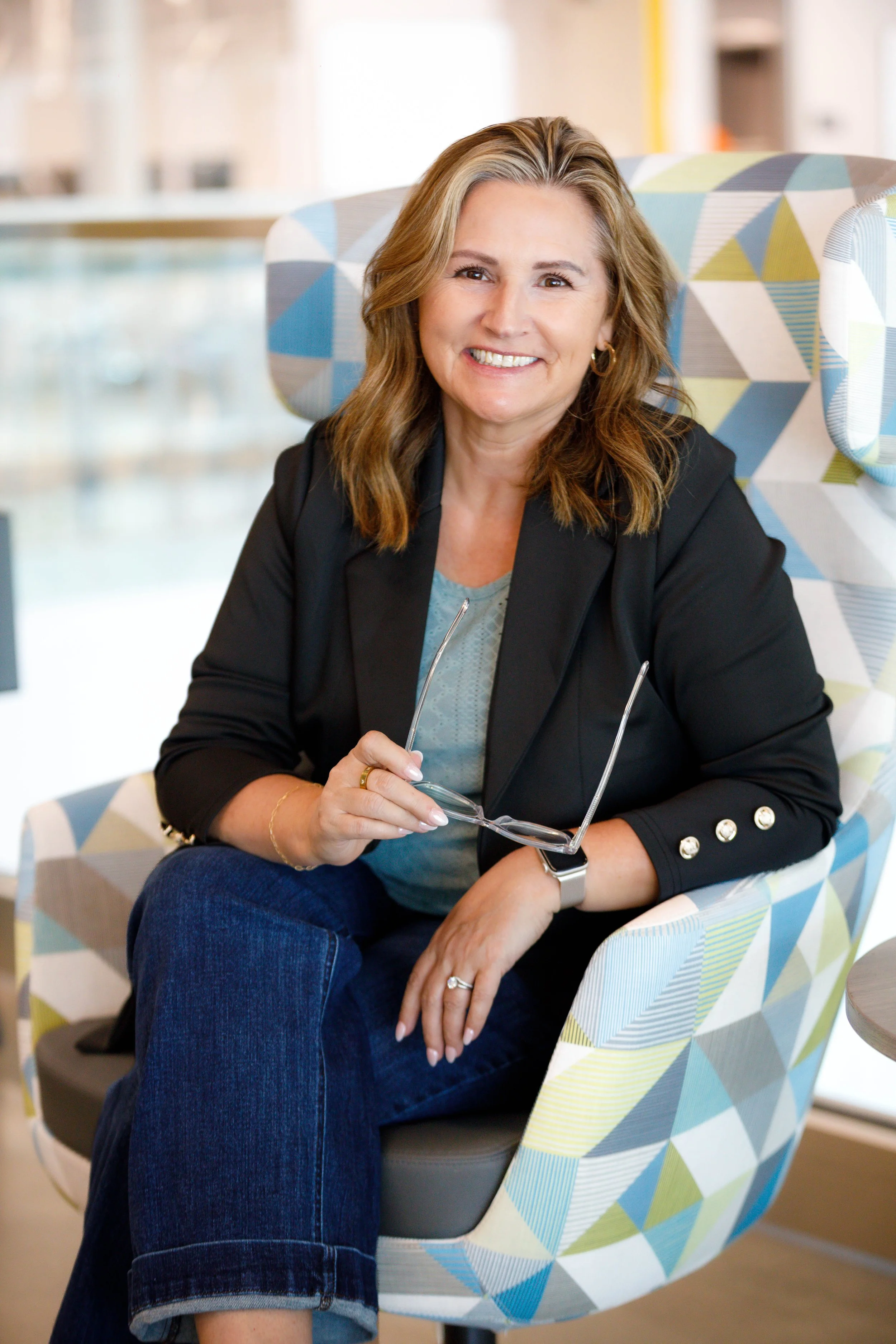 Susan Yearwood, local Grass Valley and Nevada City real estate agent, in a bright and welcoming indoor setting.