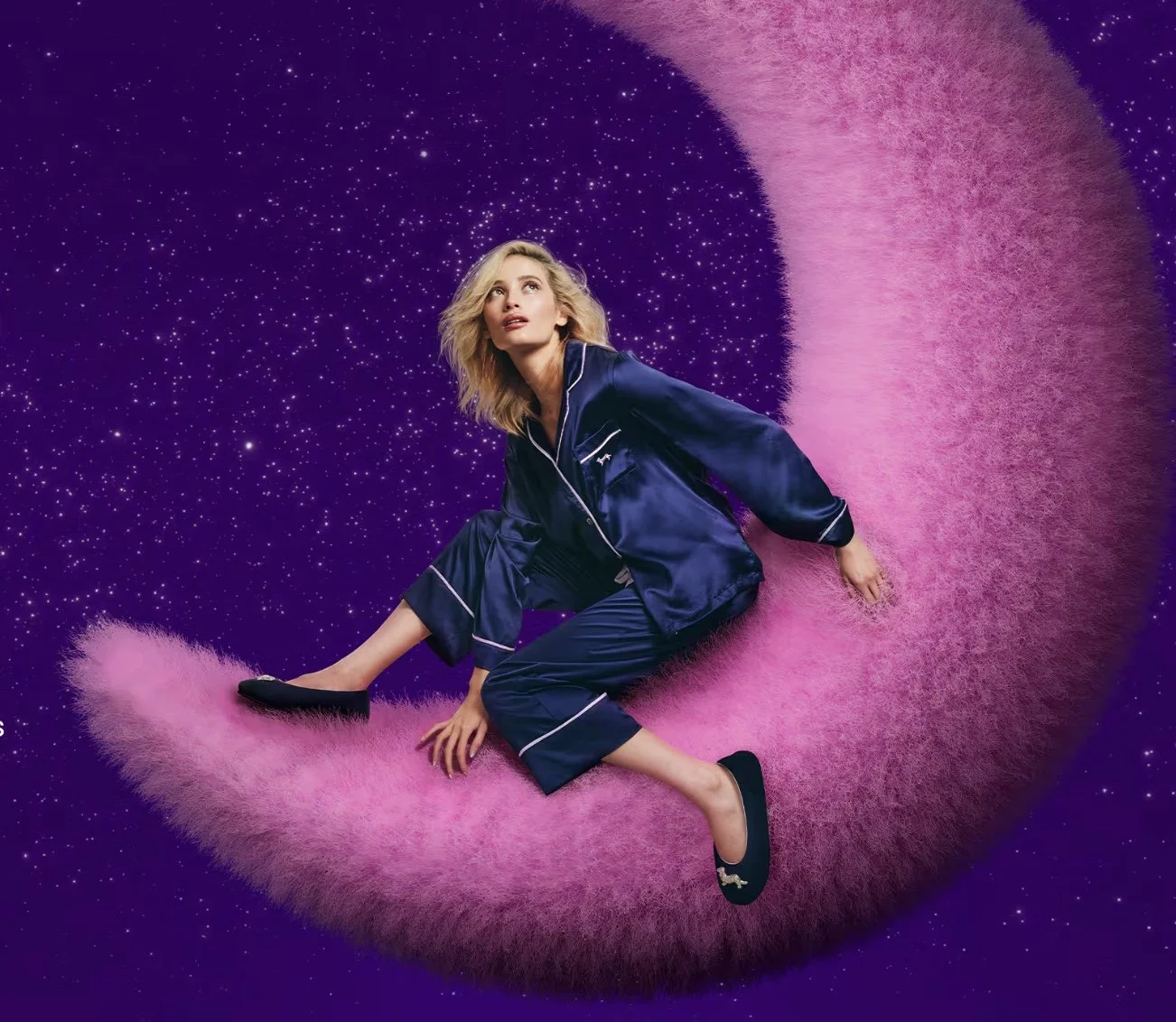 A woman in blue pajamas sitting on a pink fuzzy crescent moon against a purple starry sky background.