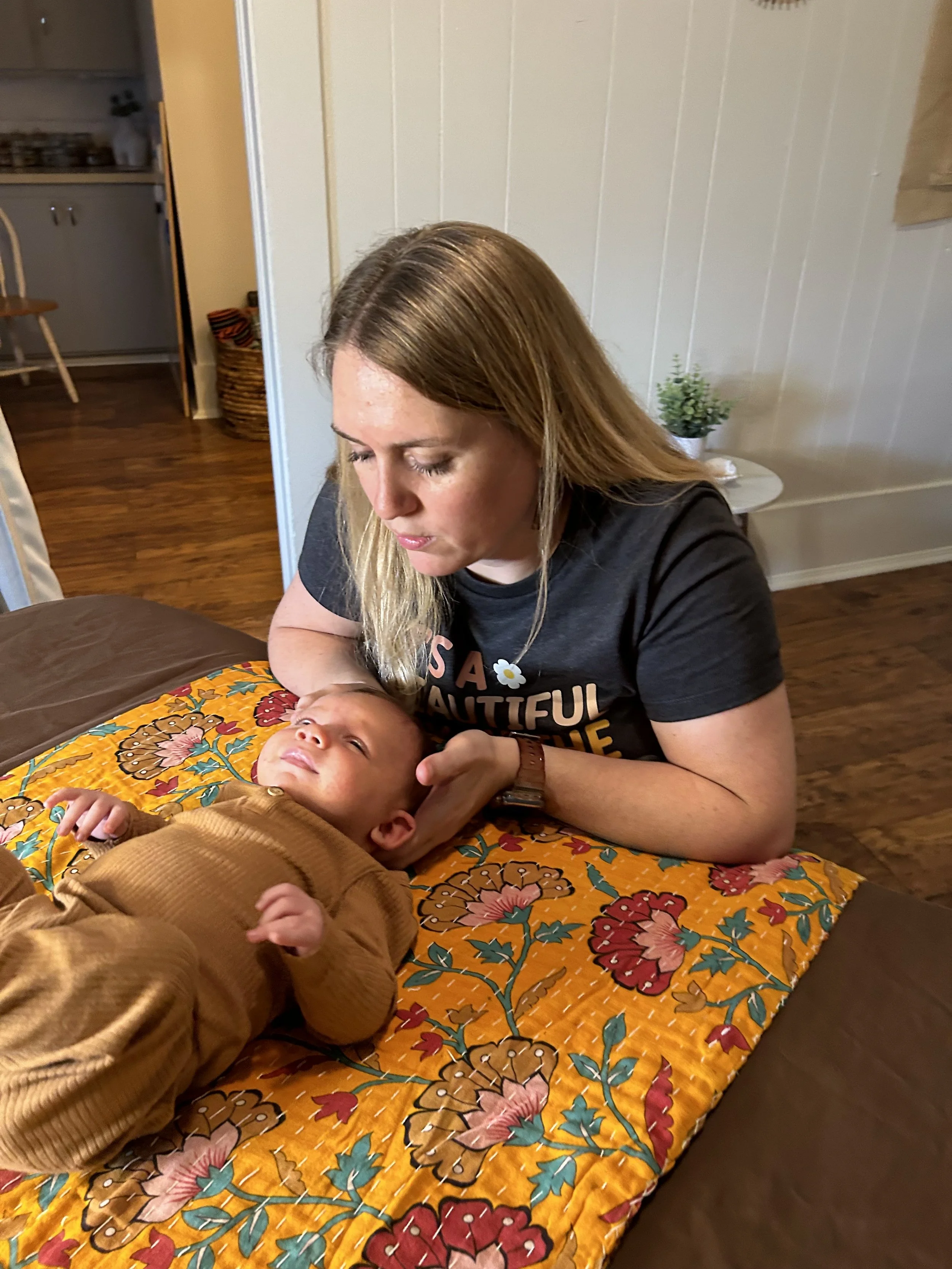 Baby receiving gentle craniosacral and infant bodywork