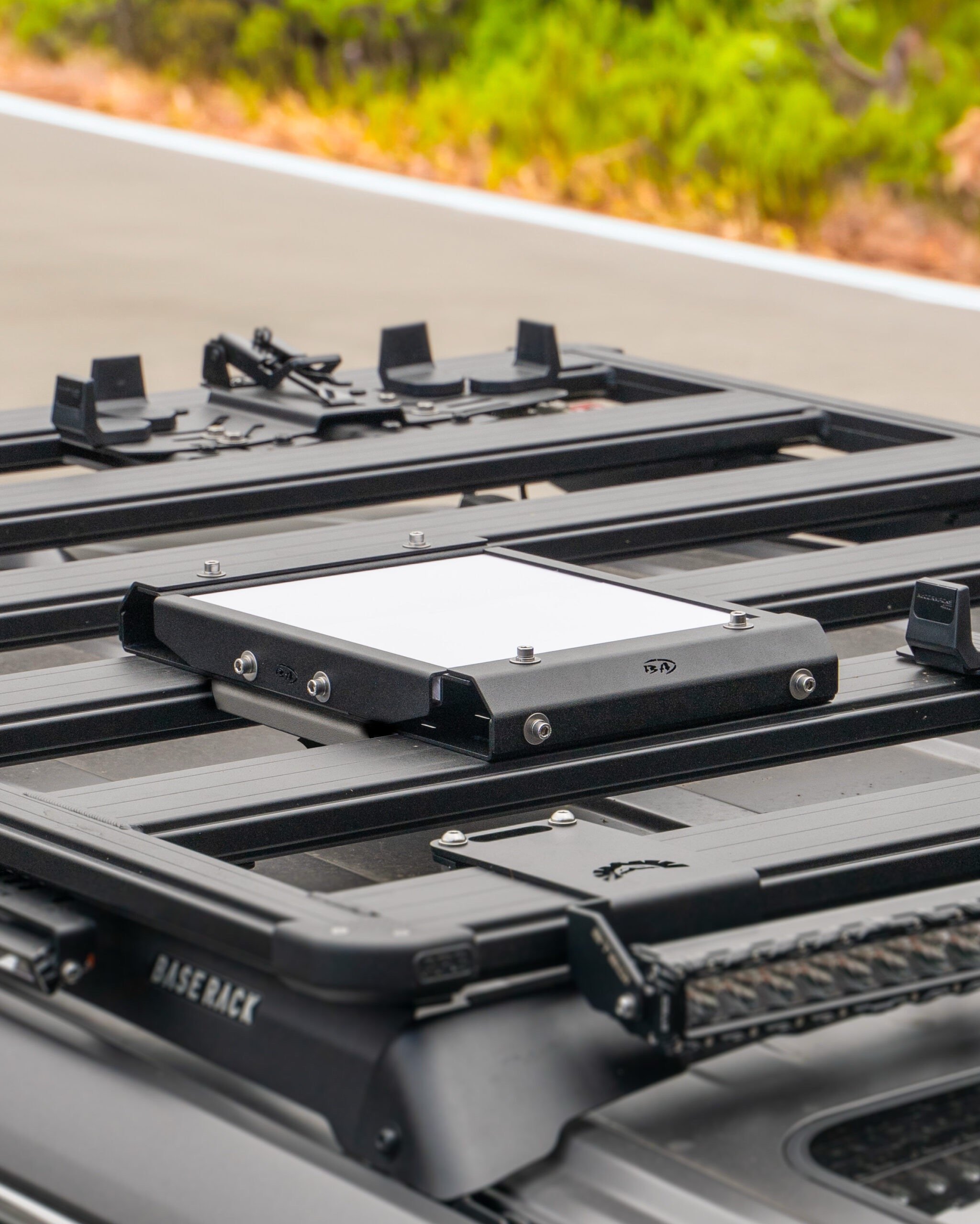 Starlink Mini antenna mounted on a vehicle roof using a Boss aluminium bracket.