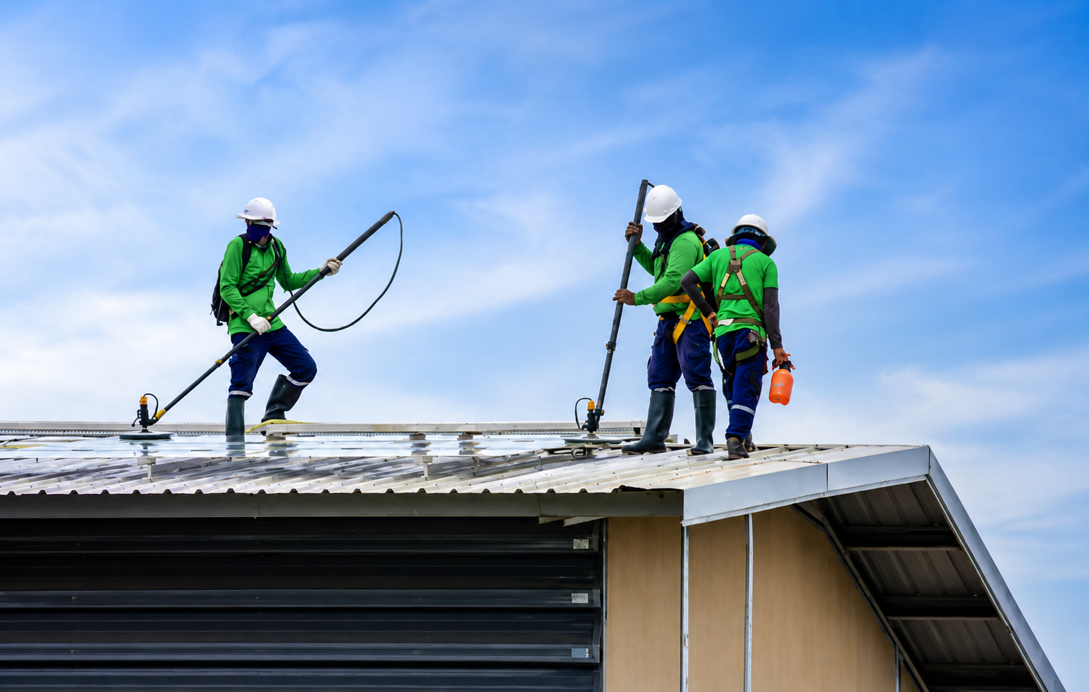 Professional commercial roofing contractors installing and maintaining a metal roofing system in North Vancouver, British Columbia