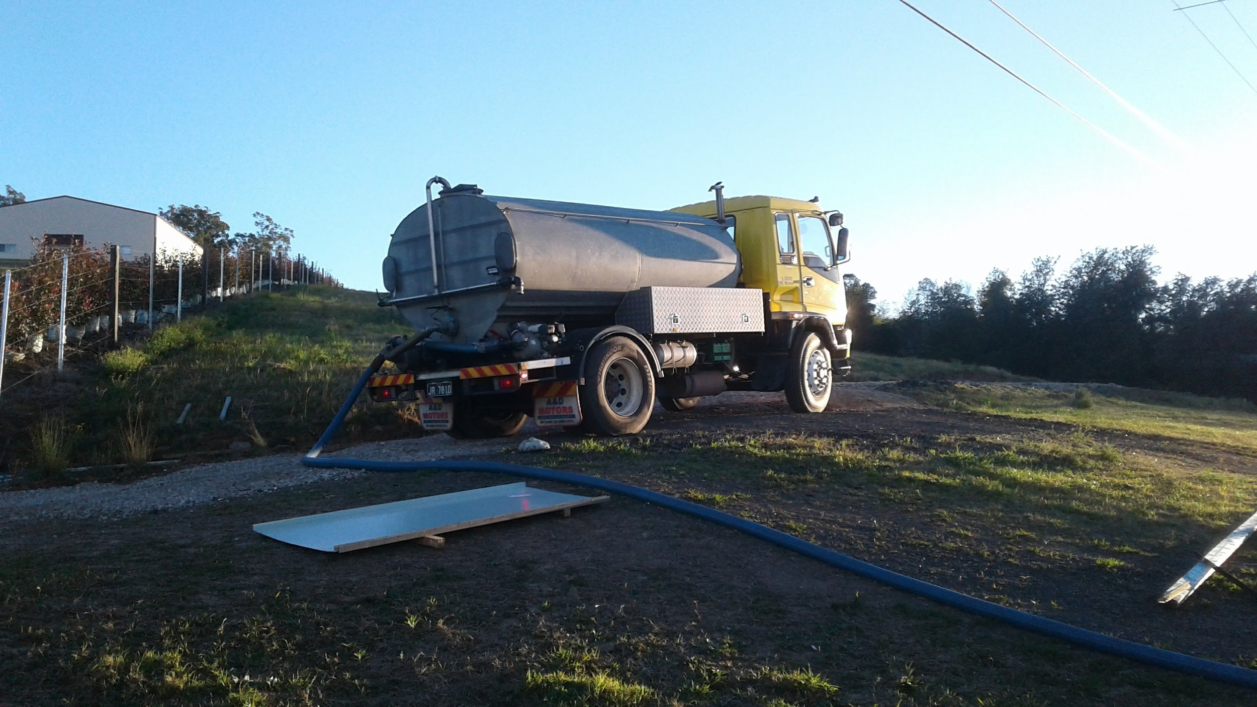 Water truck unloading at the customers property