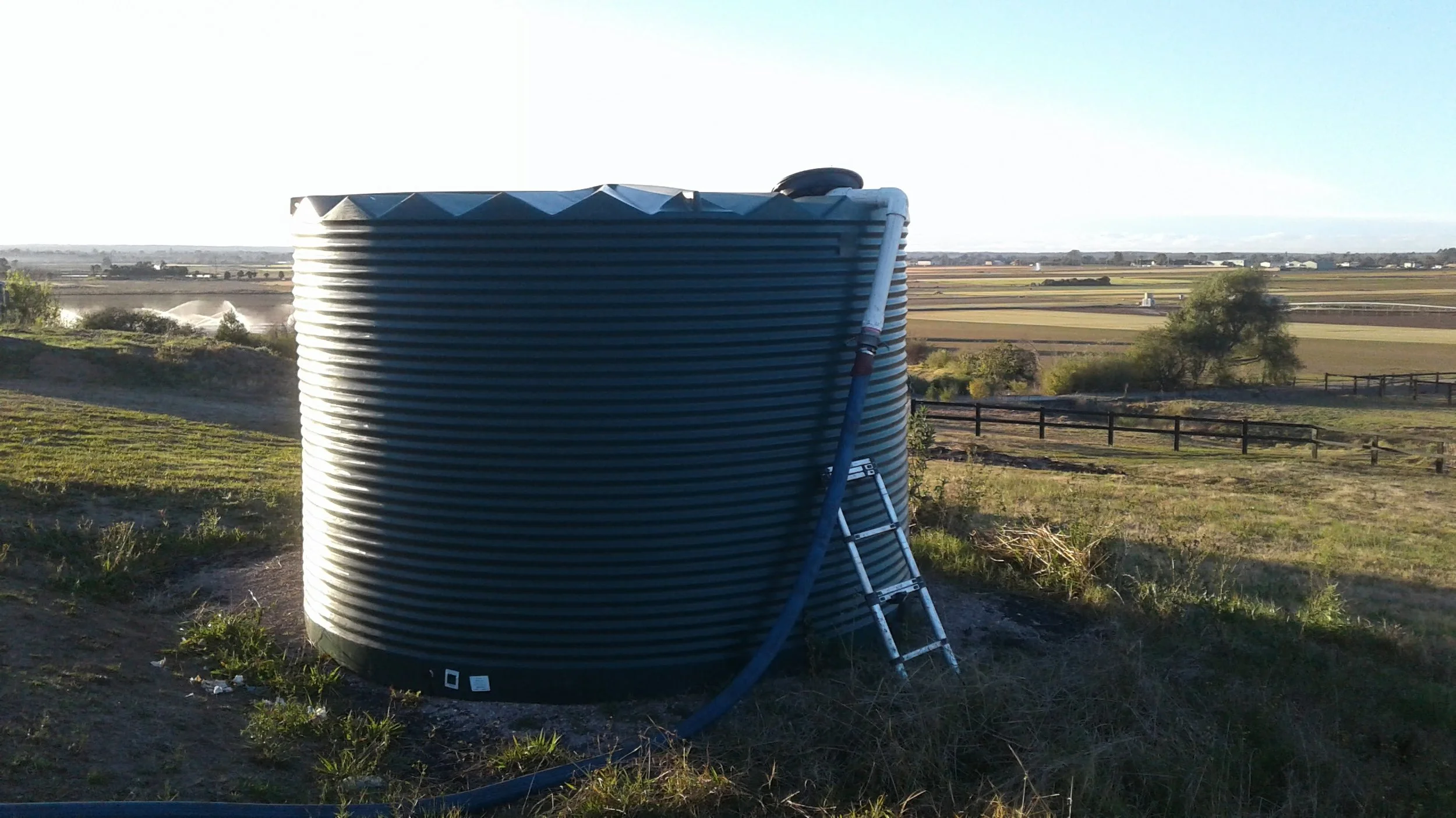 Water tank being filled by a water truck