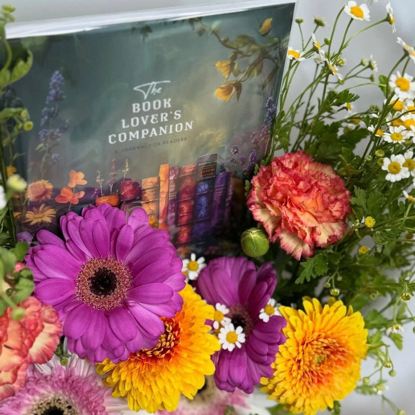 Not sure what&rsquo;s on their TBR? Gift them a Journal Book Bouquet! 

It&rsquo;s the bouquet for the thoughtful reader. This arrangement features a beautifully designed reading journal, perfect for logging titles, tracking thoughts, and setting lit