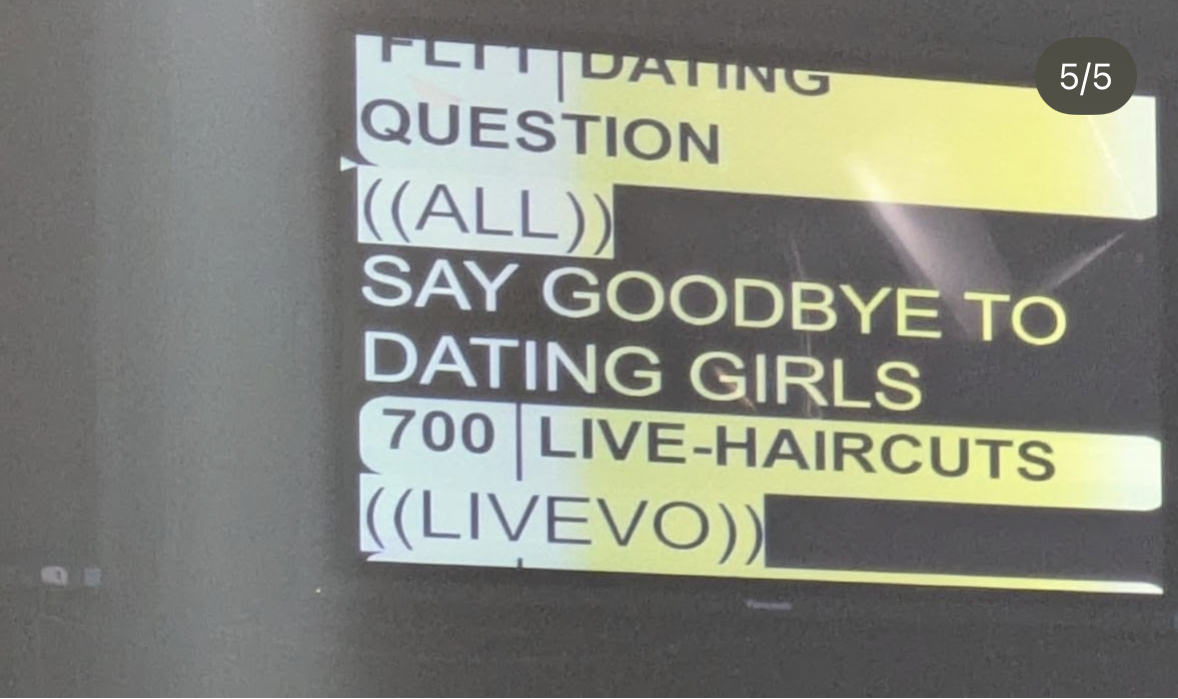 Sign with various disruptive phrases in different font sizes and colors, including yellow and white text on a black background, mentioning dating, girls, live haircuts, and a question about saying goodbye to dating girls.