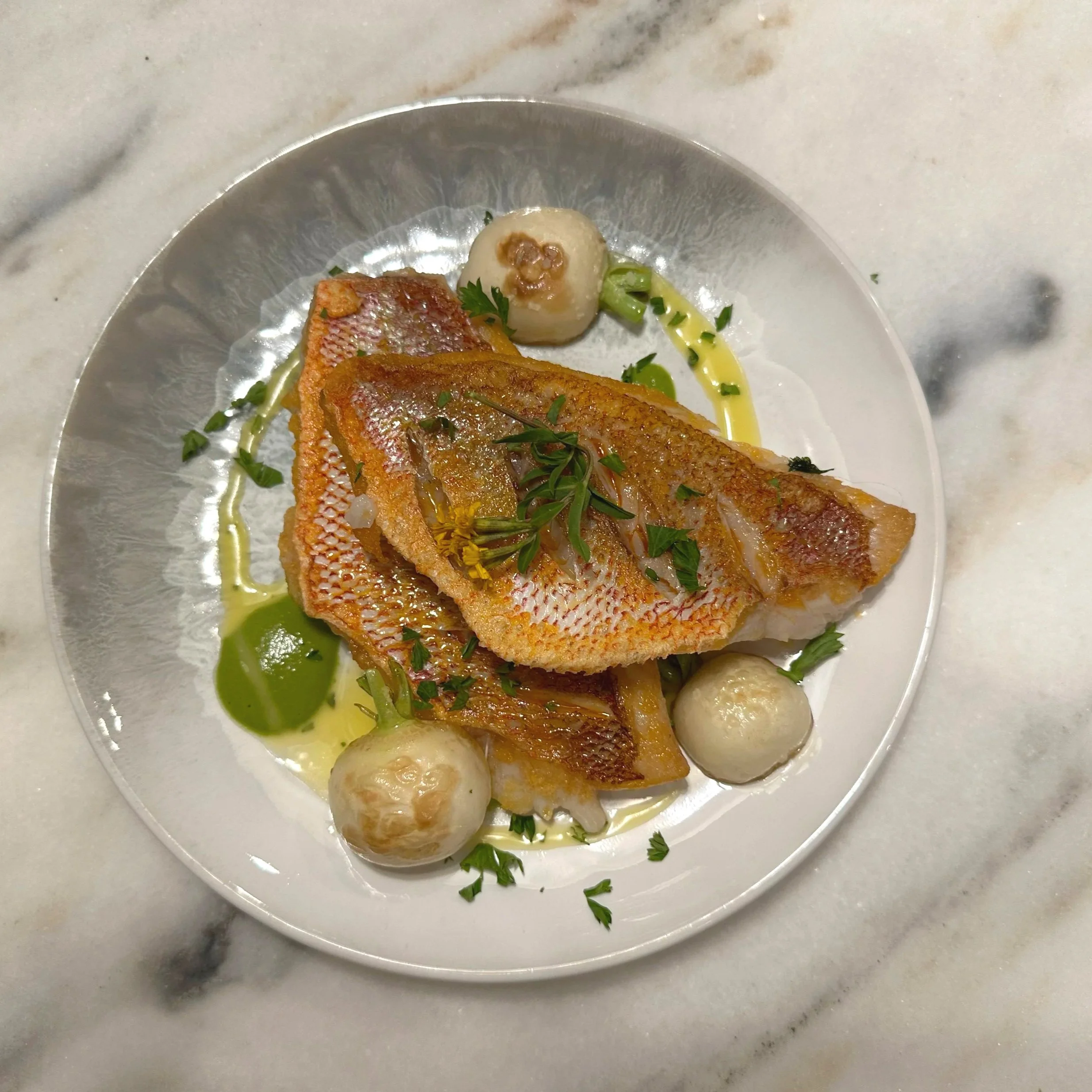 Crispy skin snapper, hakurei turnips, and herb purée.