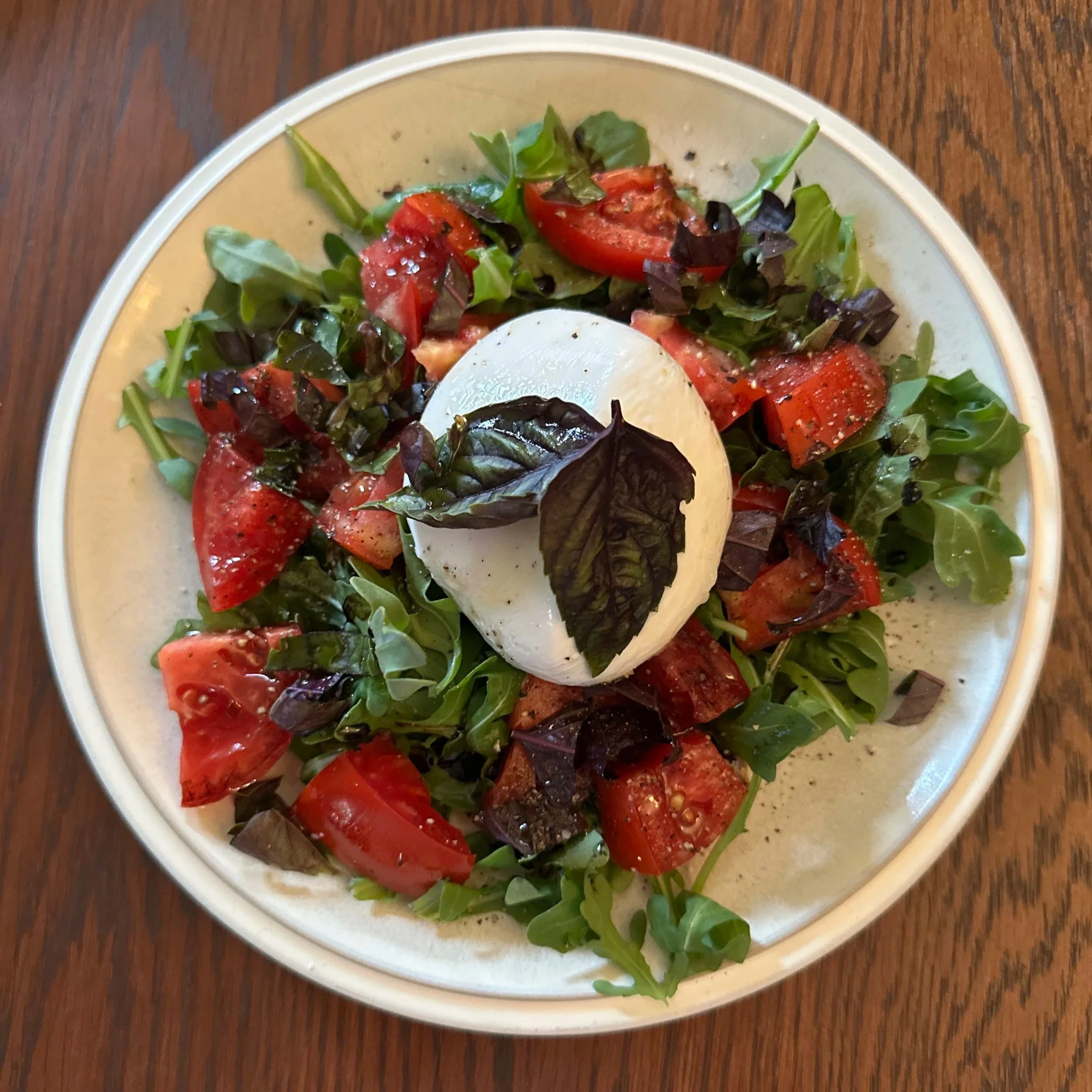 Burrata, tomato, and arugula salad.