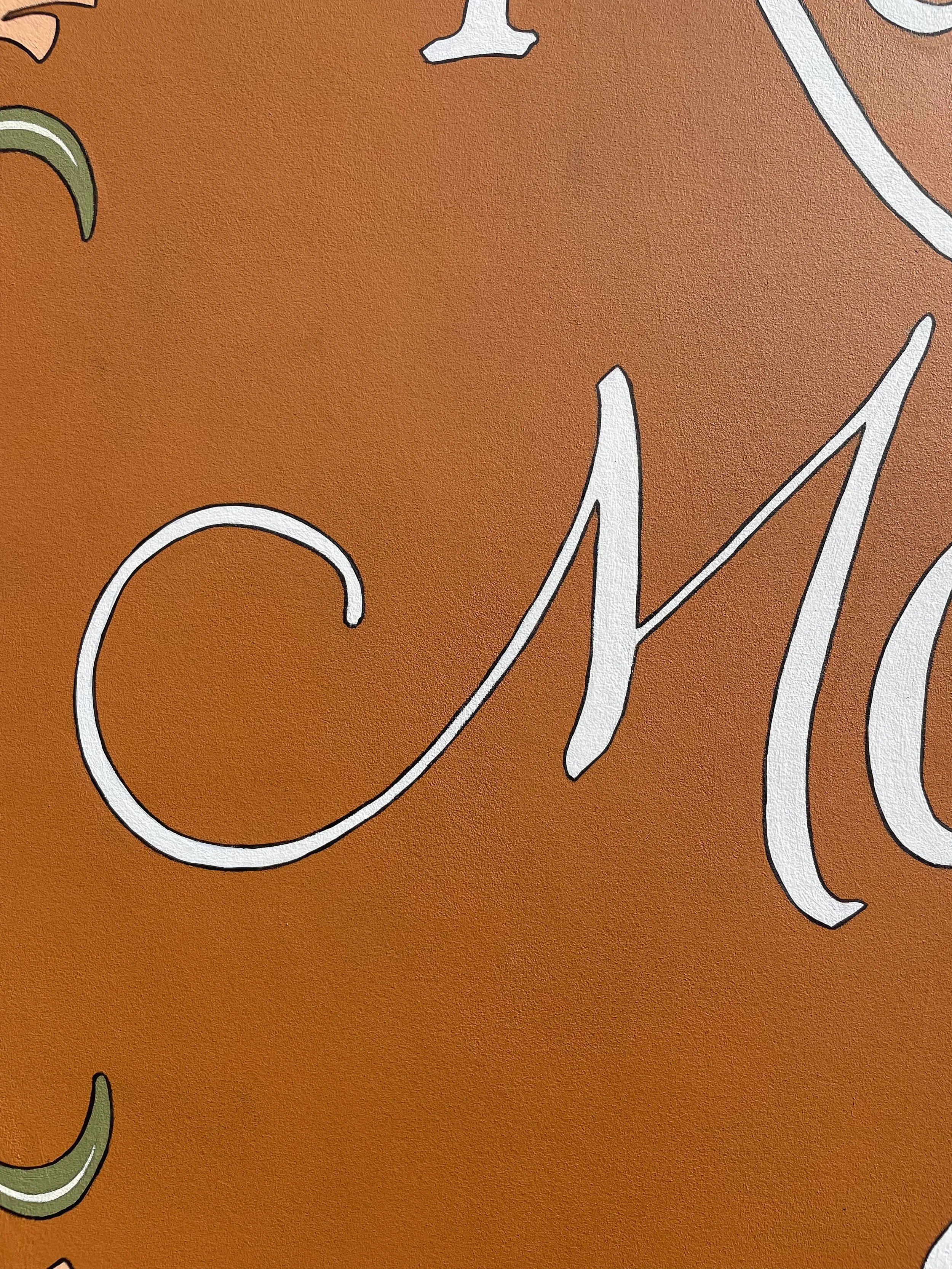 Up close sign detail: painted letters