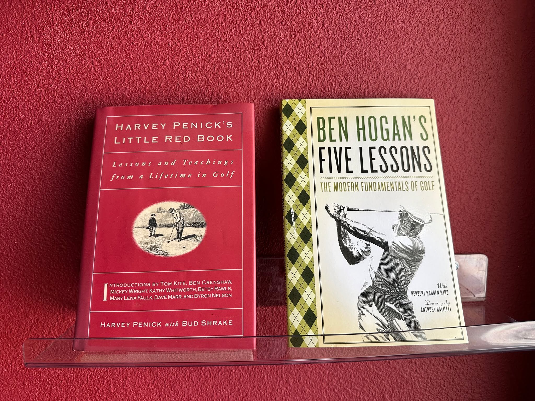 We've added some light reading to our bays that our members have been enjoying between swings, two of our all-time favorites--"Harvey Penick's Little Read Book" and "Ben Hogan's Five Lessons" because golf is hard. Rain in the fore