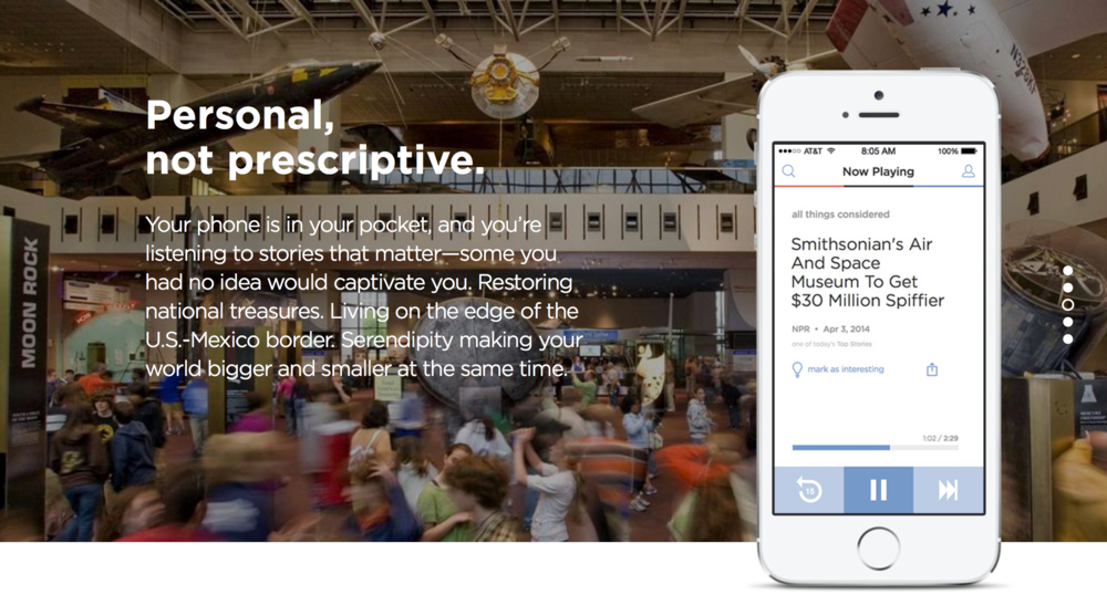 An indoor exhibit space at the Smithsonian's Air and Space Museum with a large crowd of visitors. A digital device overlay shows a podcast titled "Now Playing" about the Smithsonian's Air and Space Museum getting a $30 million boost, with a progress bar at 1:02 of 2:29.