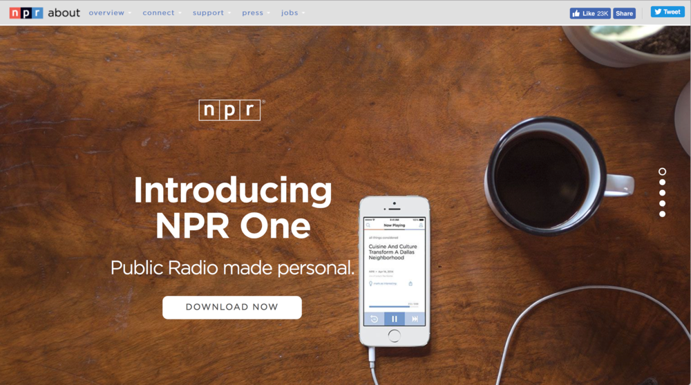 Screenshot of NPR website promoting NPR One app with a wooden table, a smartphone playing audio, a cup of coffee, and a bowl of some snack.