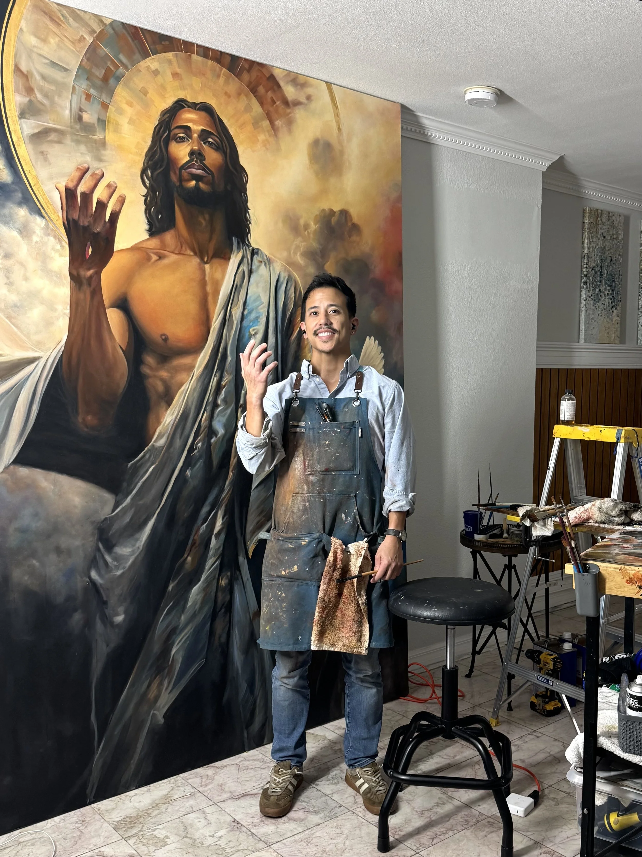 Joe Bertucci standing beside his six-by-eight-foot painting Behold, I Make All Things New