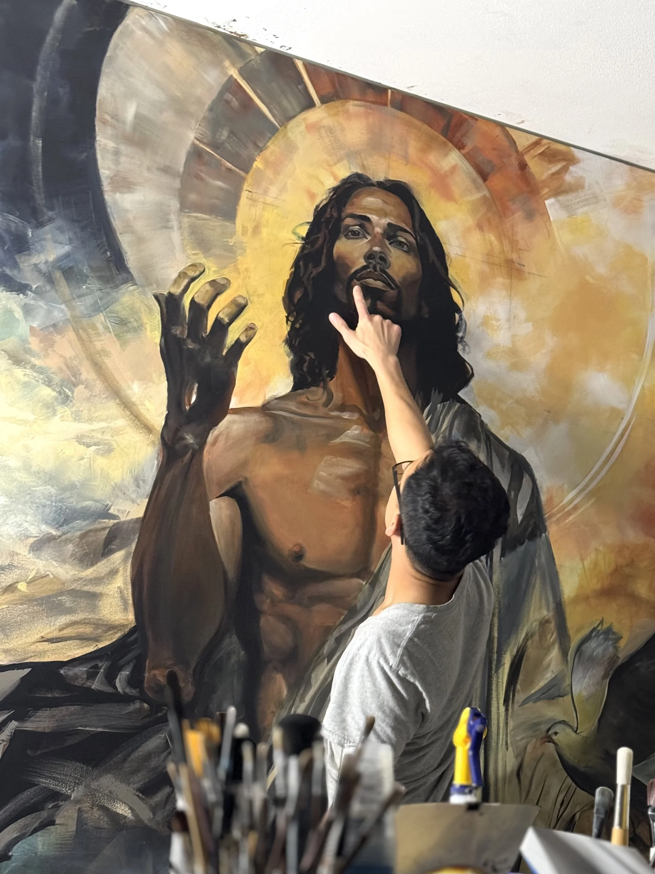 Joe Bertucci painting Christ’s face and halo for Behold