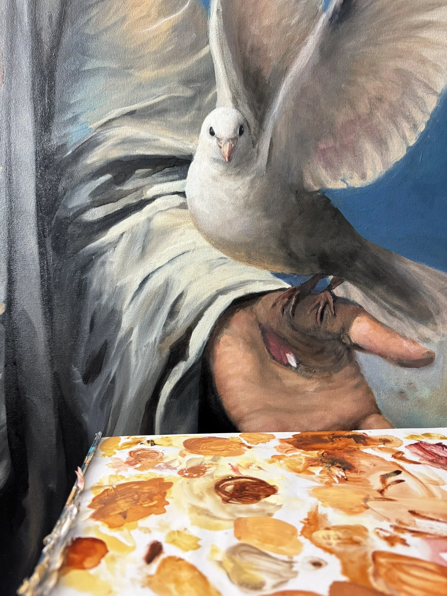Joe Bertucci painting the dove in Behold
