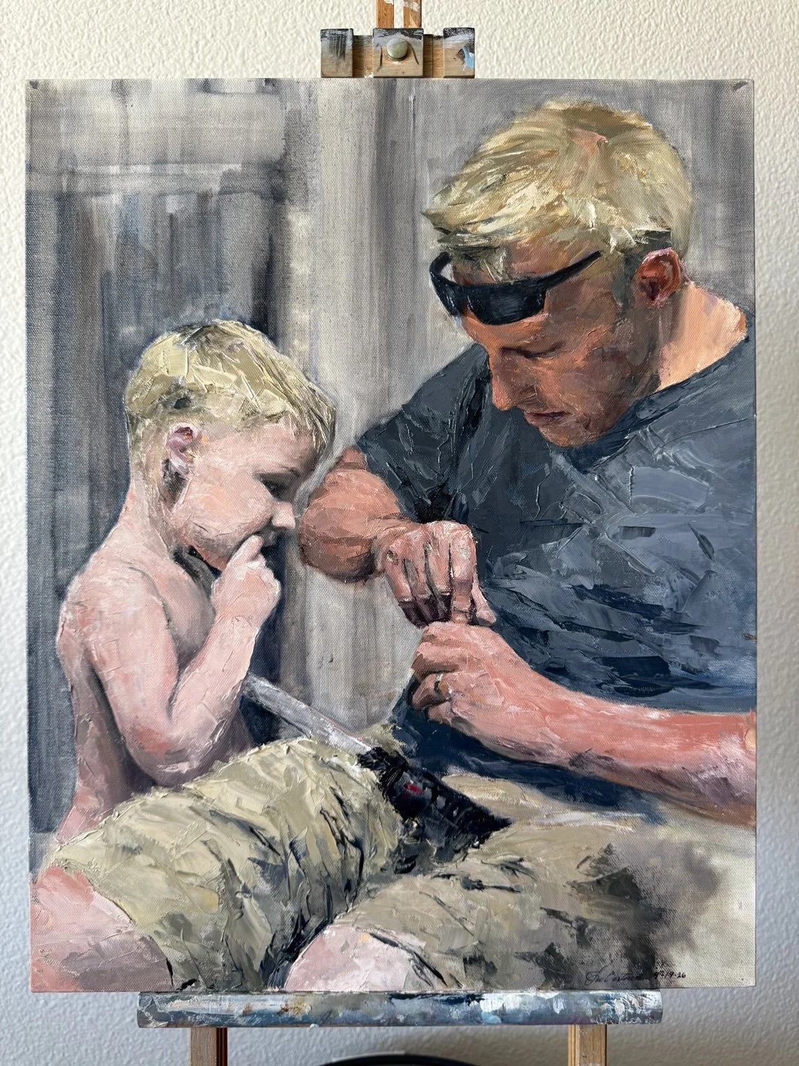 What We Mend — oil painting by Joseph Bertucci depicting a father and his young son.