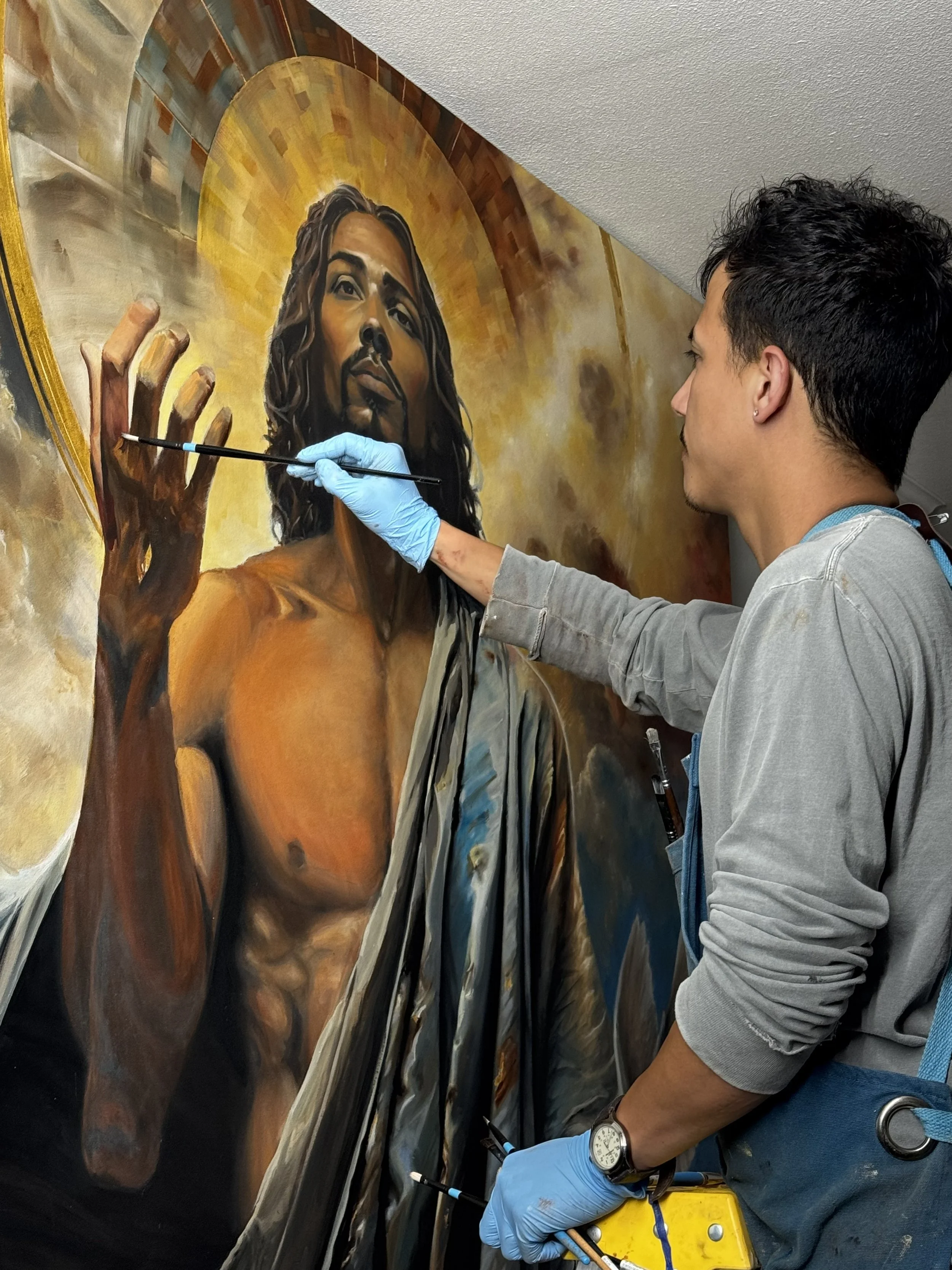 Joe Bertucci painting details on the face of Christ