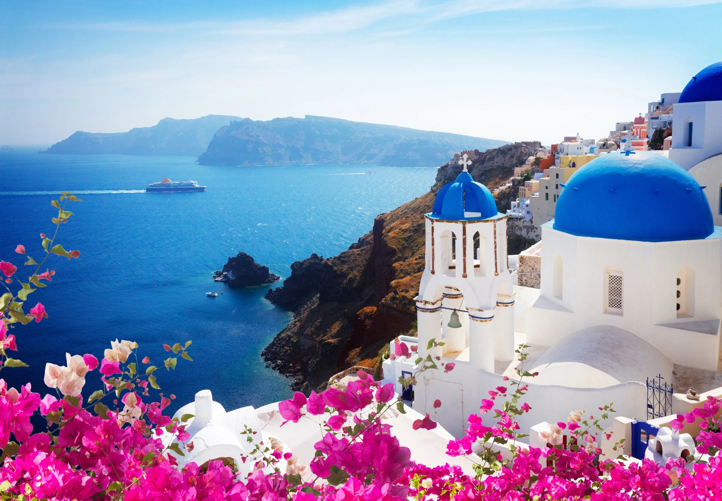 Santorini, Greece overlooking the sea — destination retreat setting for EVOLV women’s identity reinvention retreats