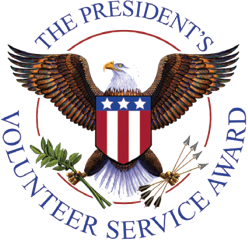 A logo with a white key that has wings, set against an orange circular background.