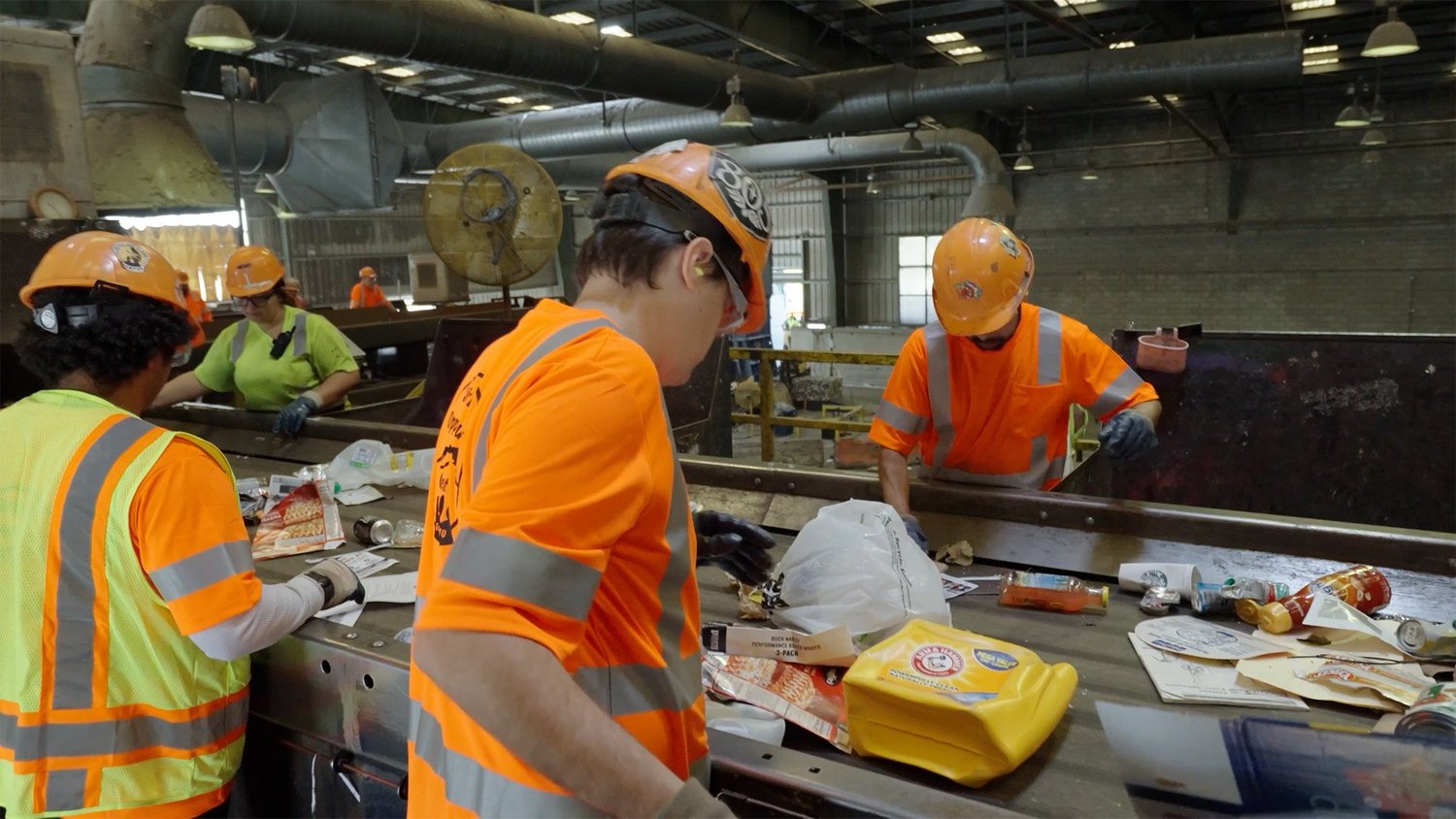 SOC crew sorting material on the recycling line