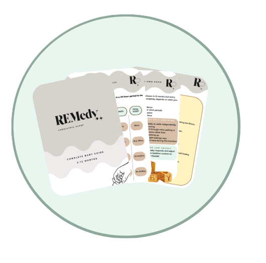 A set of printed breastfeeding guides and informational pamphlets on a round surface.