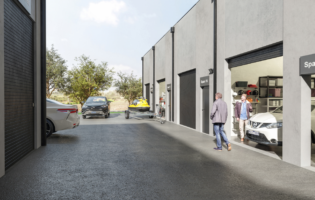 A parking garage with multiple cars parked outside and inside, including a yellow jet ski on a trailer, with two men walking and talking near the entrance.