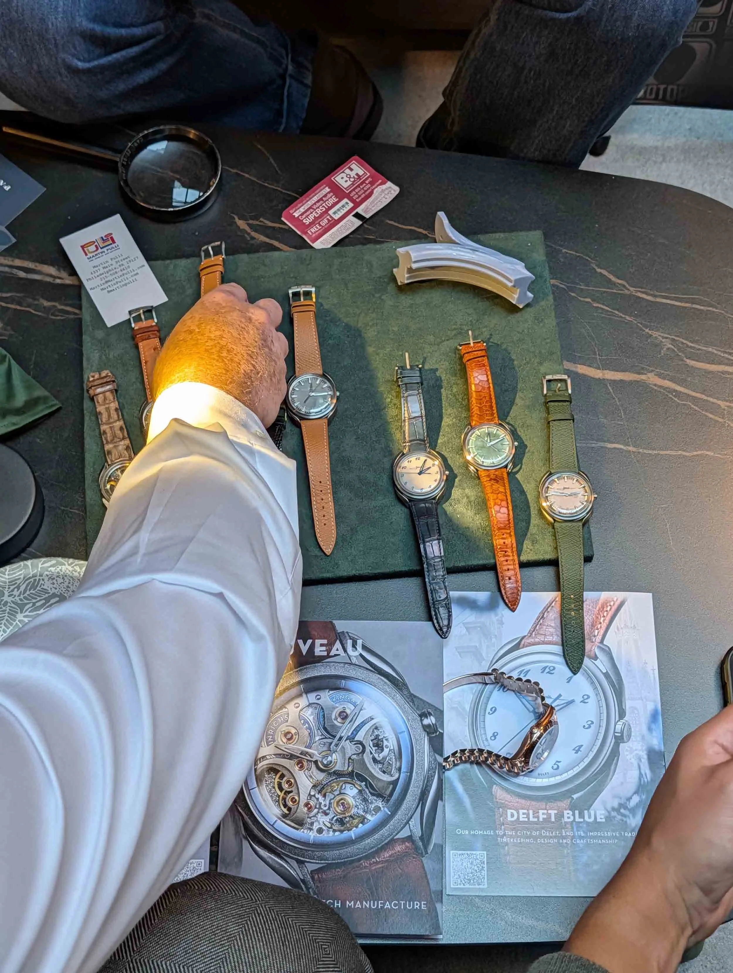 Holthinrichs 'Delft Blue' watches being inspected by collectors.