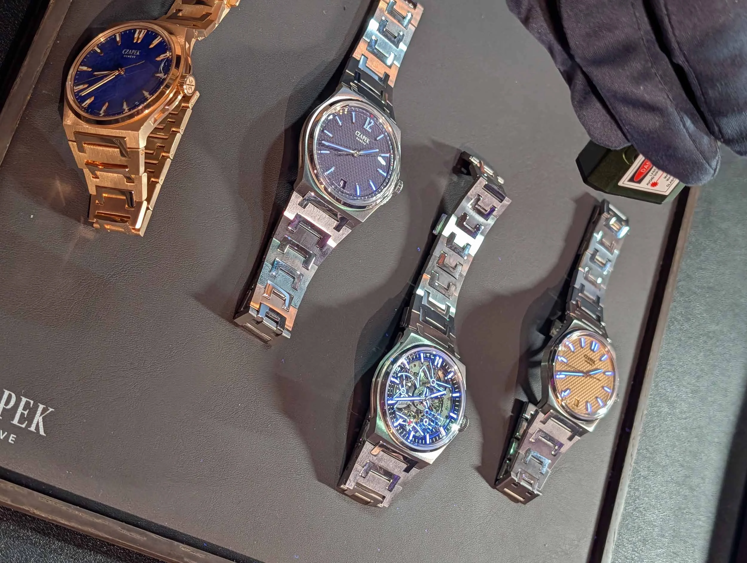 Czapek Antarctique collection featuring rose gold and steel integrated bracelet models on a display tray.