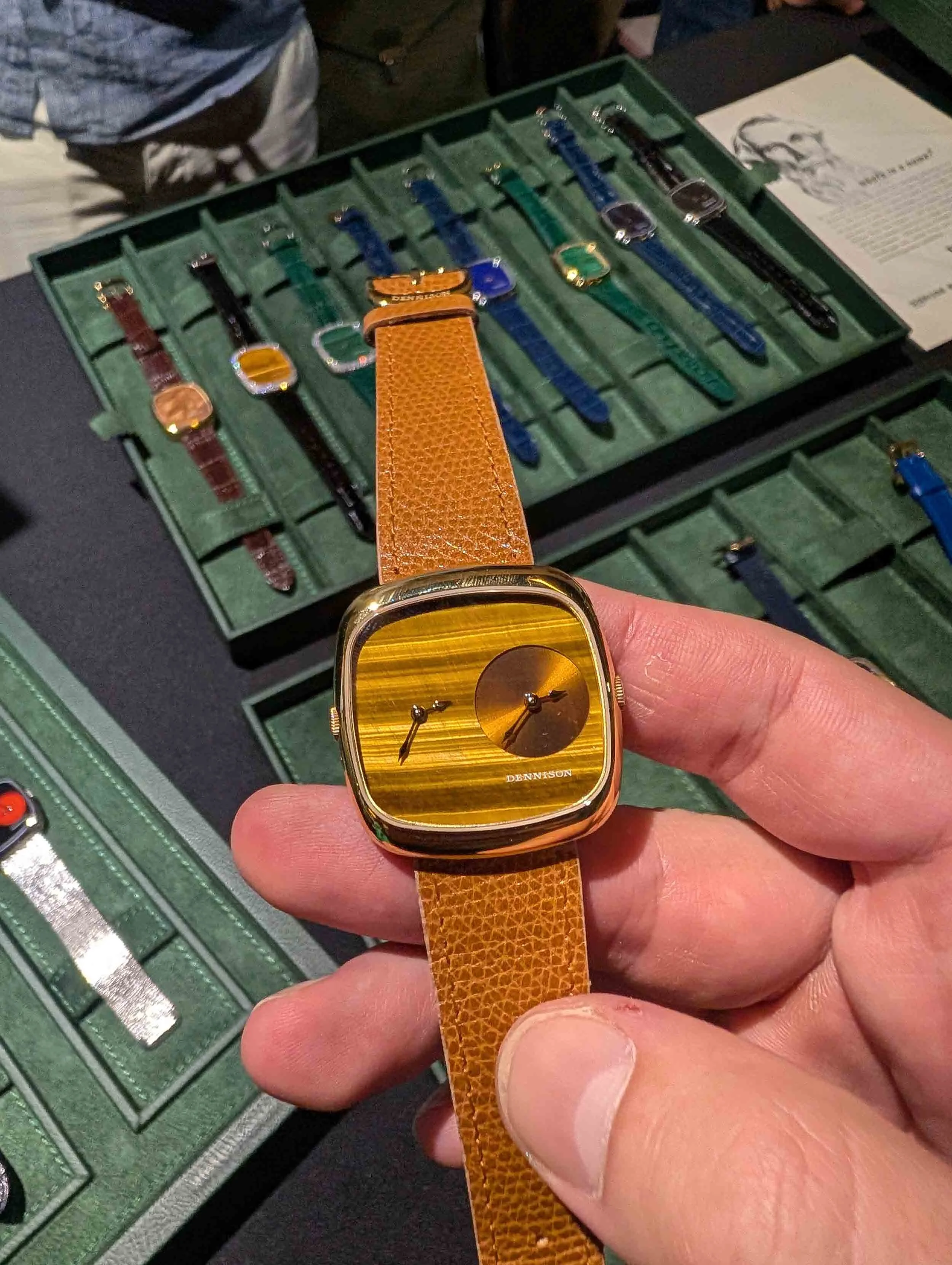 Dennison Dual-Time watch with Tiger Eye being admired by a club member.