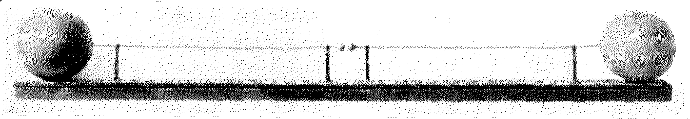 Black and white image of a two balls with a line each positioned towards each other