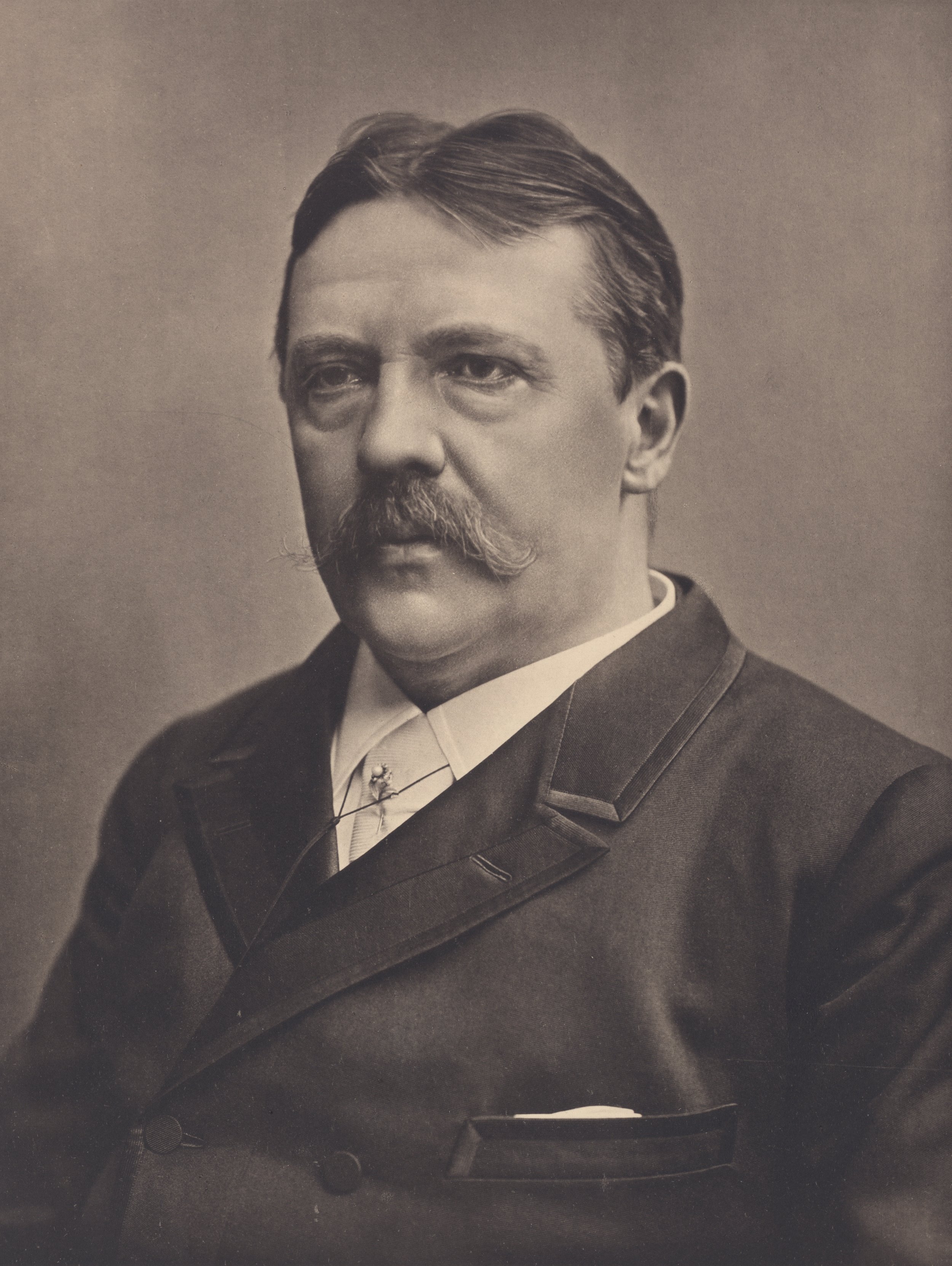Black and white photo of an older male writer