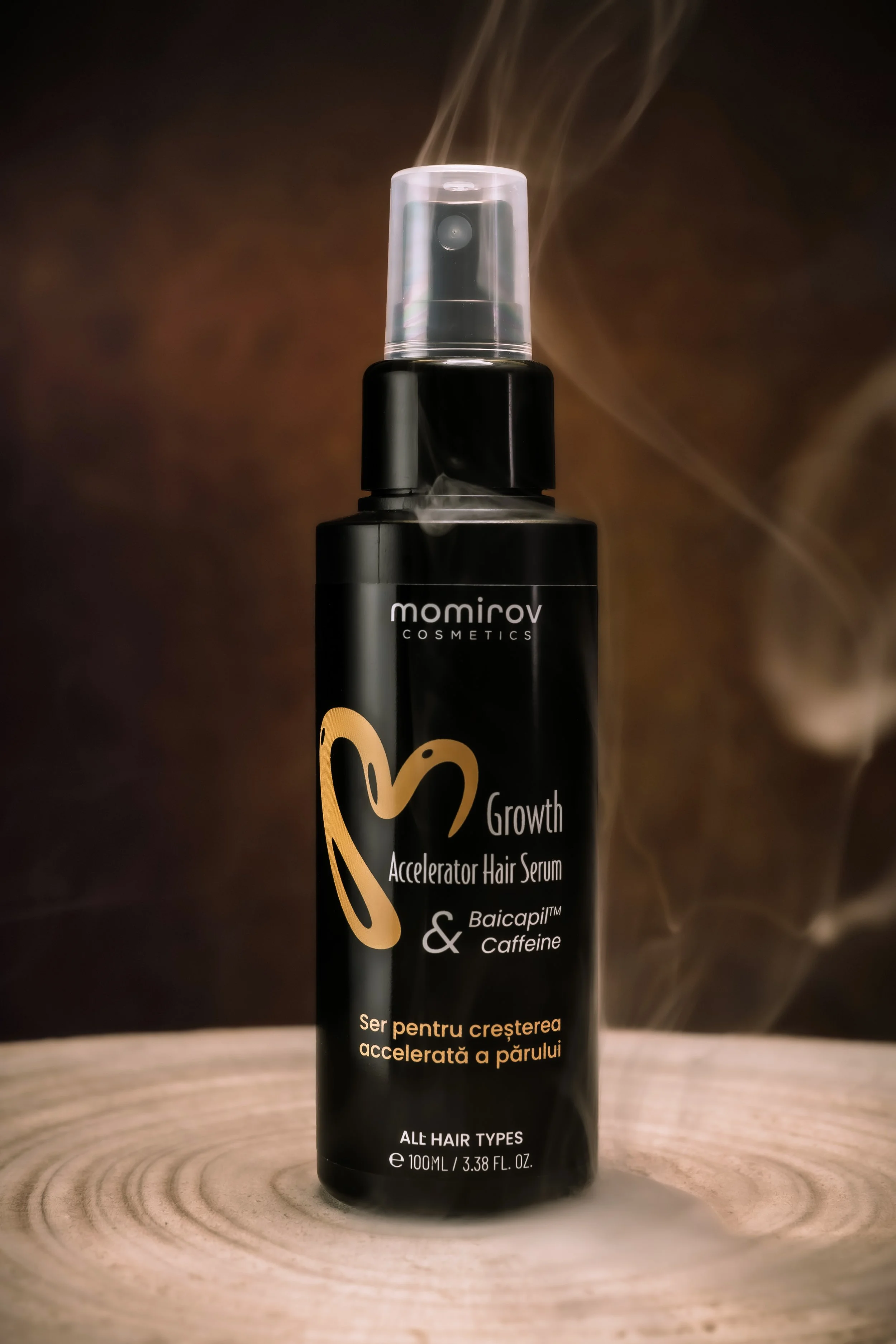 Hair serum product photographed with atmospheric smoke and warm studio lighting.