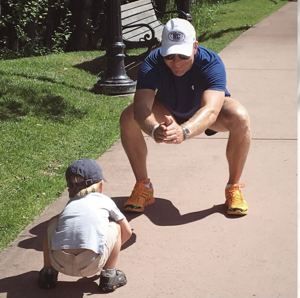 Daniel Fatzinger and his father in Beaver Creek, Colorado, in an alpine skiing downhill tuck position. Daniel is trying to model after his dad on a summer day.