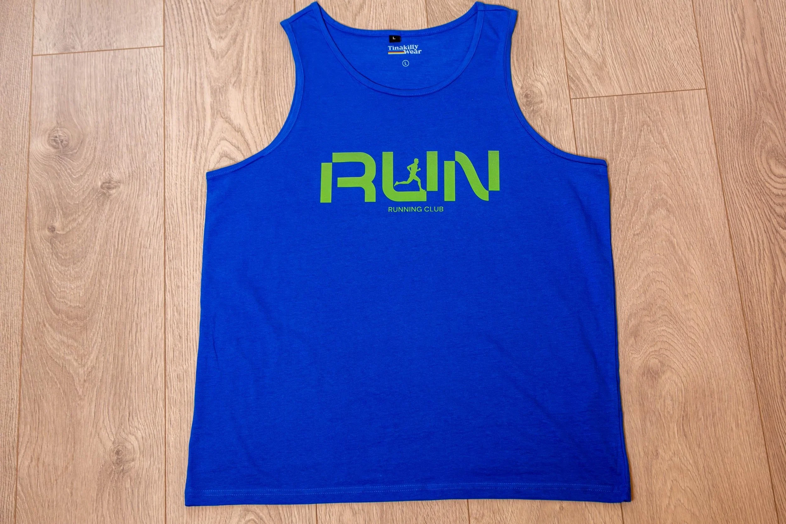 Blue sleeveless tank top with the word 'RUN' in green and a small running figure inside the letter 'U', and the words 'Running Club' underneath printed on the front.