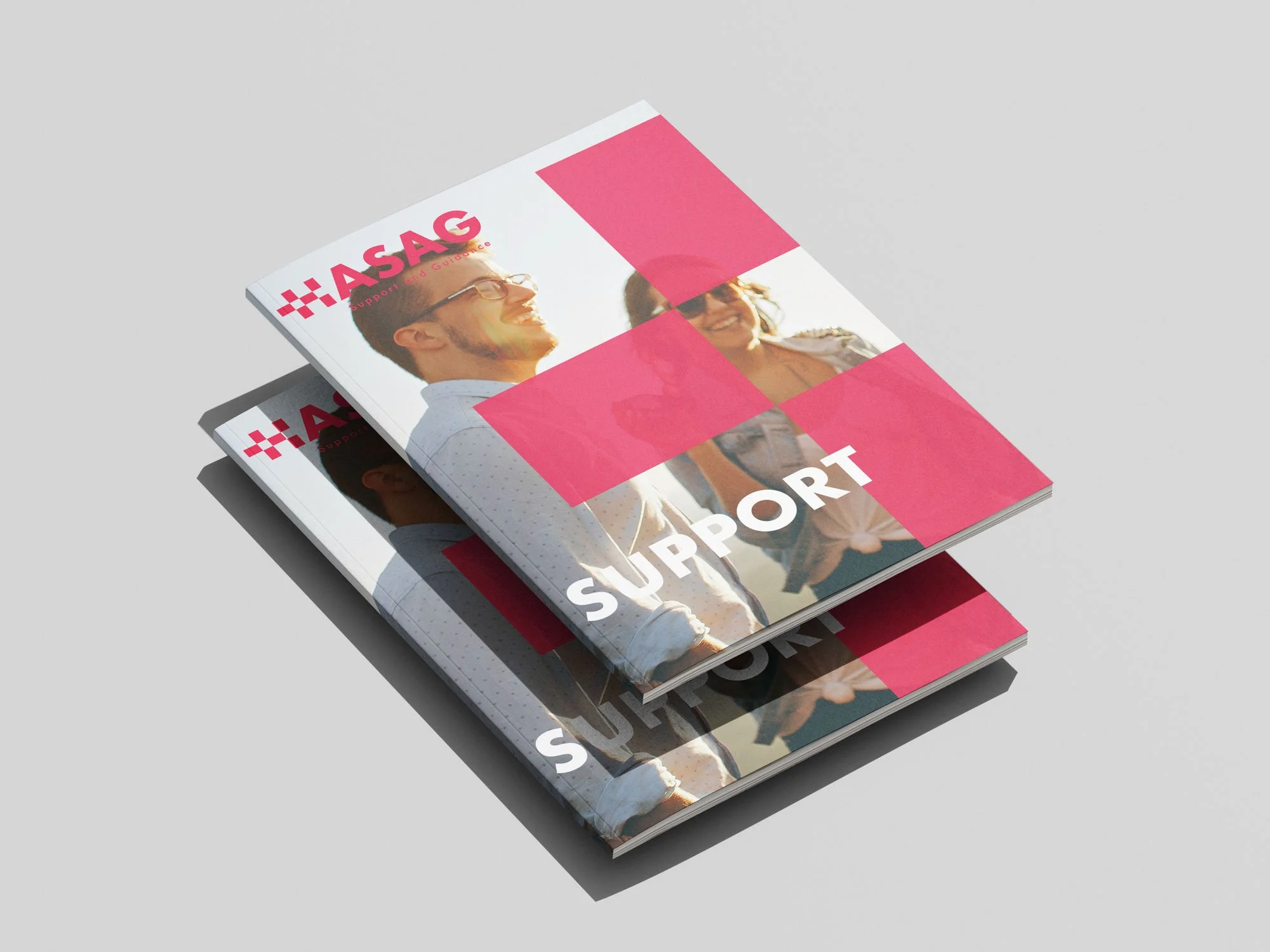 Two printed reports with the title "Support" and the logo "ASAG," featuring a photograph of smiling people outdoors on the cover.