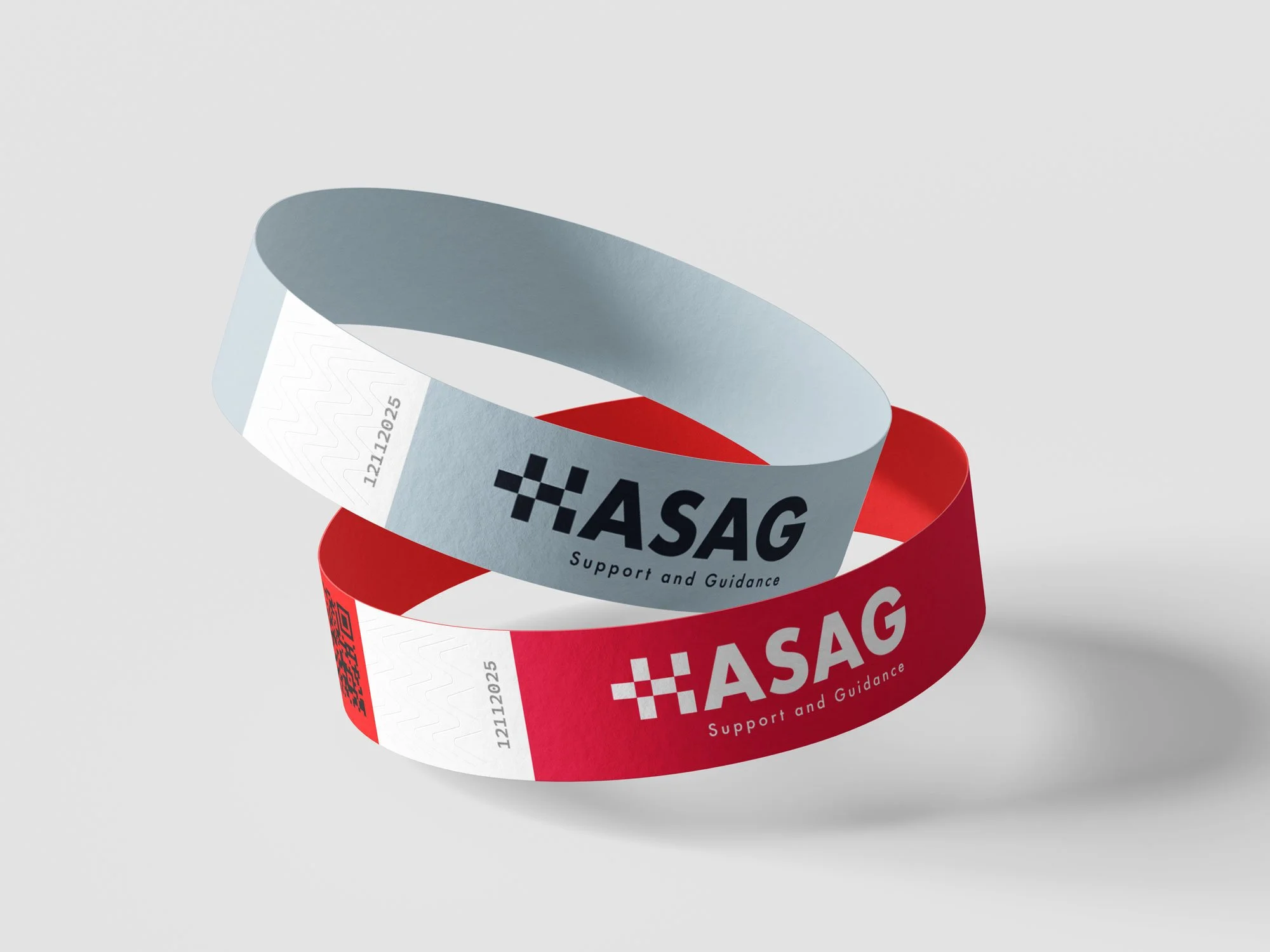 Two ASAG support and guidance wristbands, one red and one white, with black text and a checkered logo, placed on a light gray background.