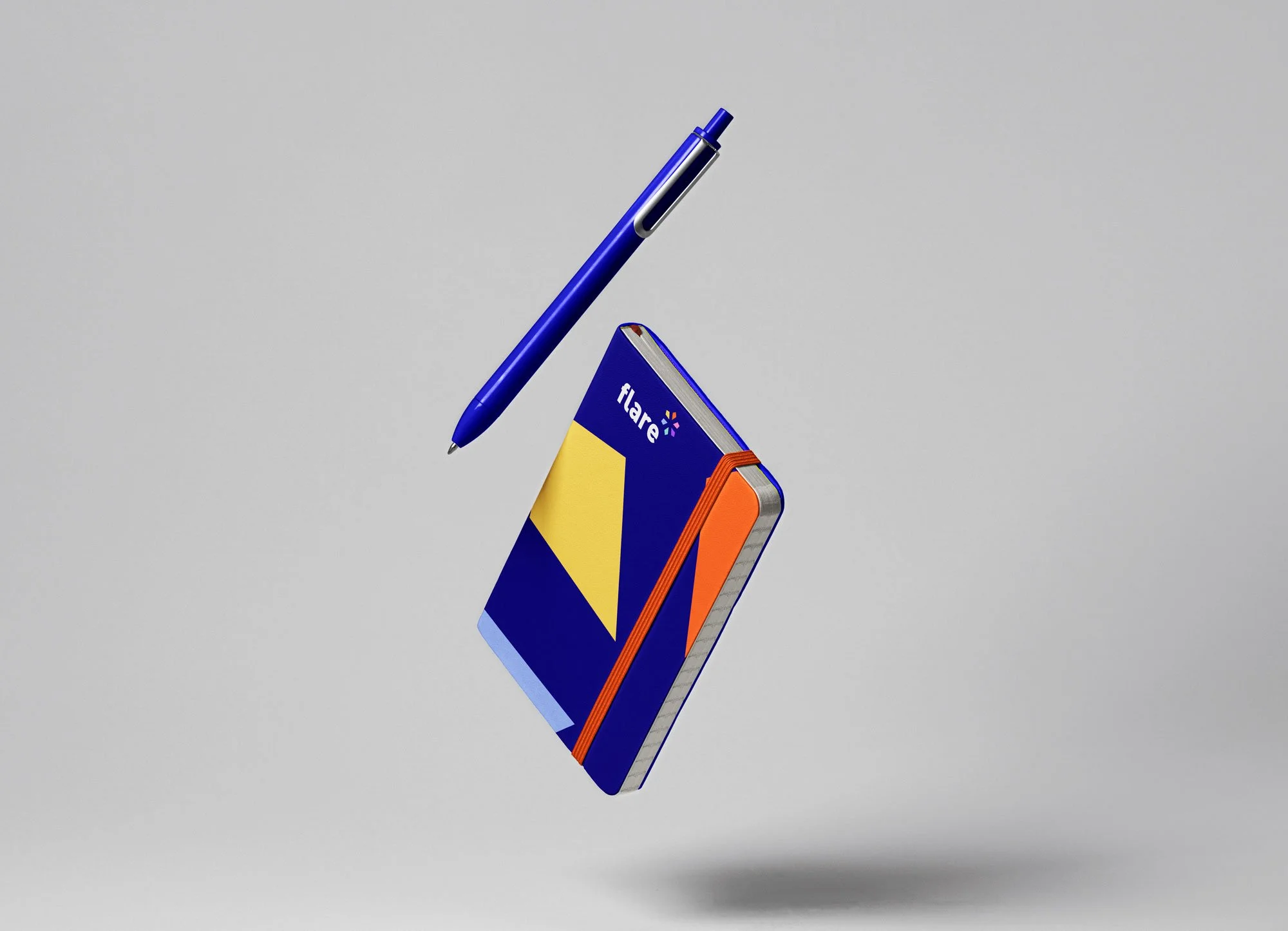 A blue and orange Flare notebook with a yellow triangle on the cover, a blue pen, and an orange elastic band, all floating against a plain gray background.