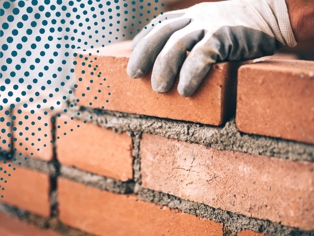 Image of a brick wall being built.