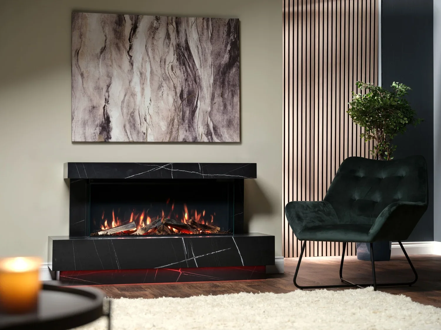 Modern living room with a black marble fireplace, abstract artwork on the wall, a green armchair, a potted plant, and a white rug.