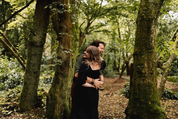 Candid wedding videographer capturing fun engagement session.