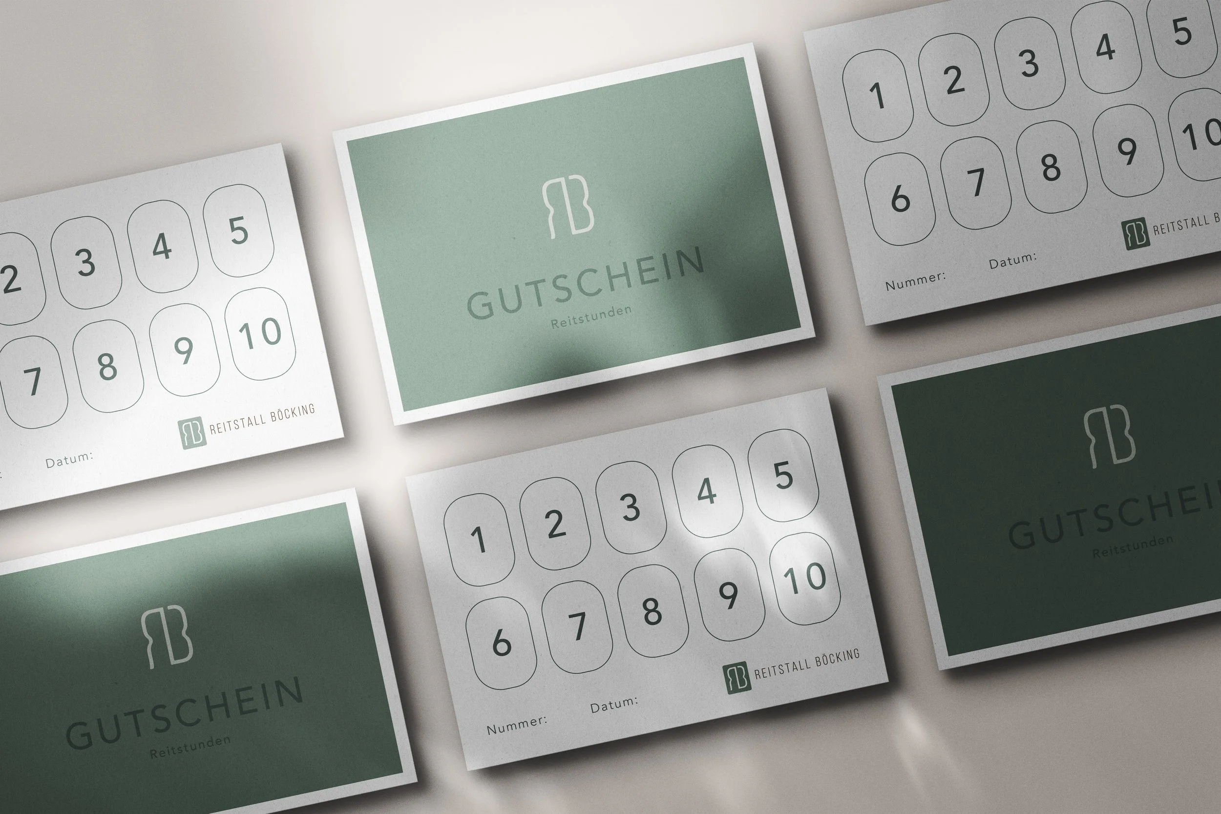 Multiple small gift certificates with a green and white design, featuring numbered punch cards and the text 'Gutschein Reitstunden' for horseback riding lessons, laid out on a light surface.