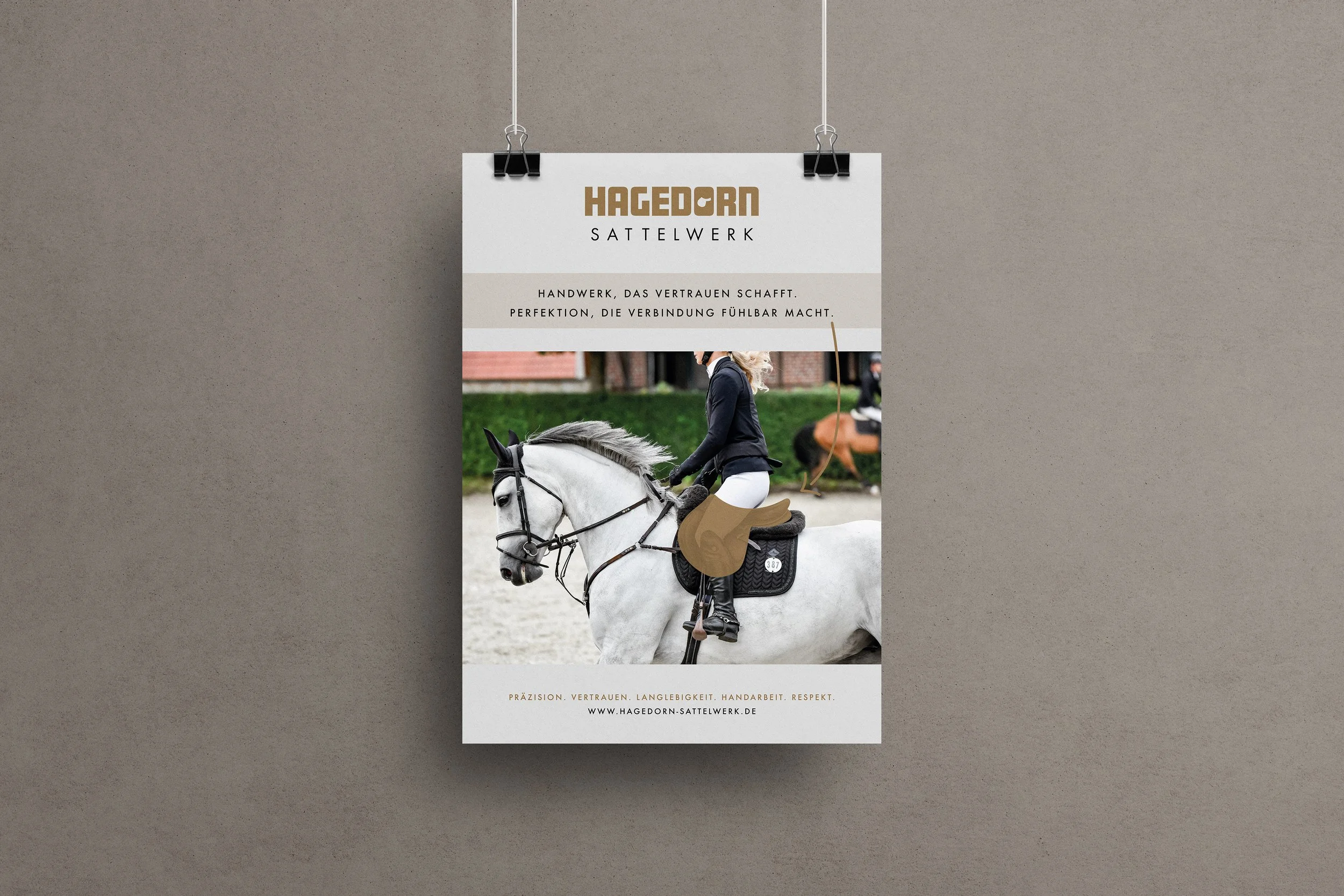 A poster advertising Hagedorn Sattlerwerk features a woman riding a white horse, dressed in riding attire, with other riders and horses in the background.