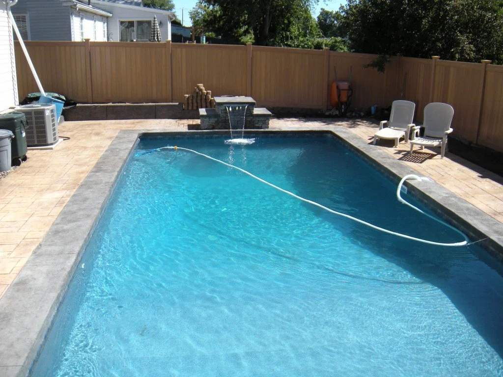 Spartan-Concrete-Services-StampConcretePoolPatio-waterfeature.jpg