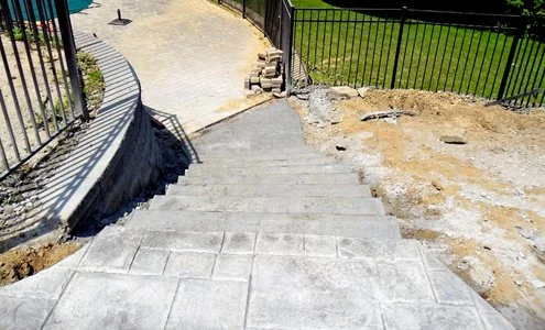 SpartanConcreteServices-ConcreteCurvedStairs-Landing-patio.jpg
