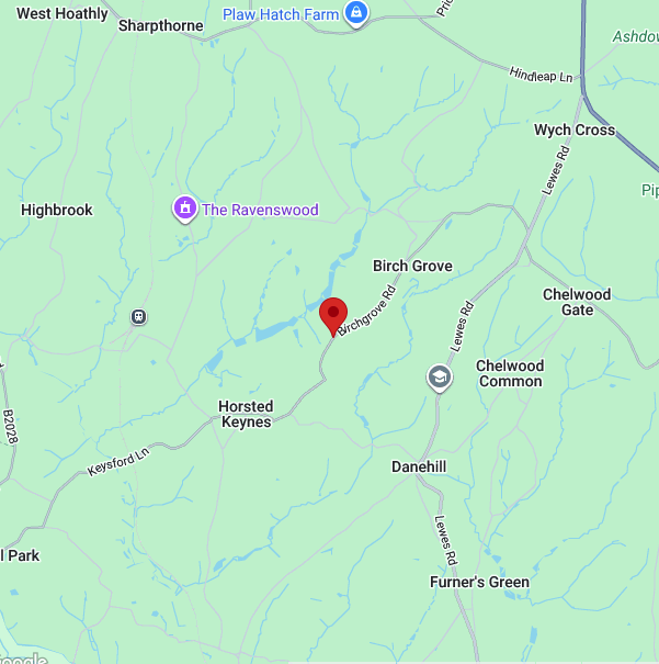Map showing Birchgrove Road in a rural area with nearby locations including The Ravenswood, Chelwood Gate, Wych Cross, and Cheldwood Common, with a few farms, crossroads, and streams present.