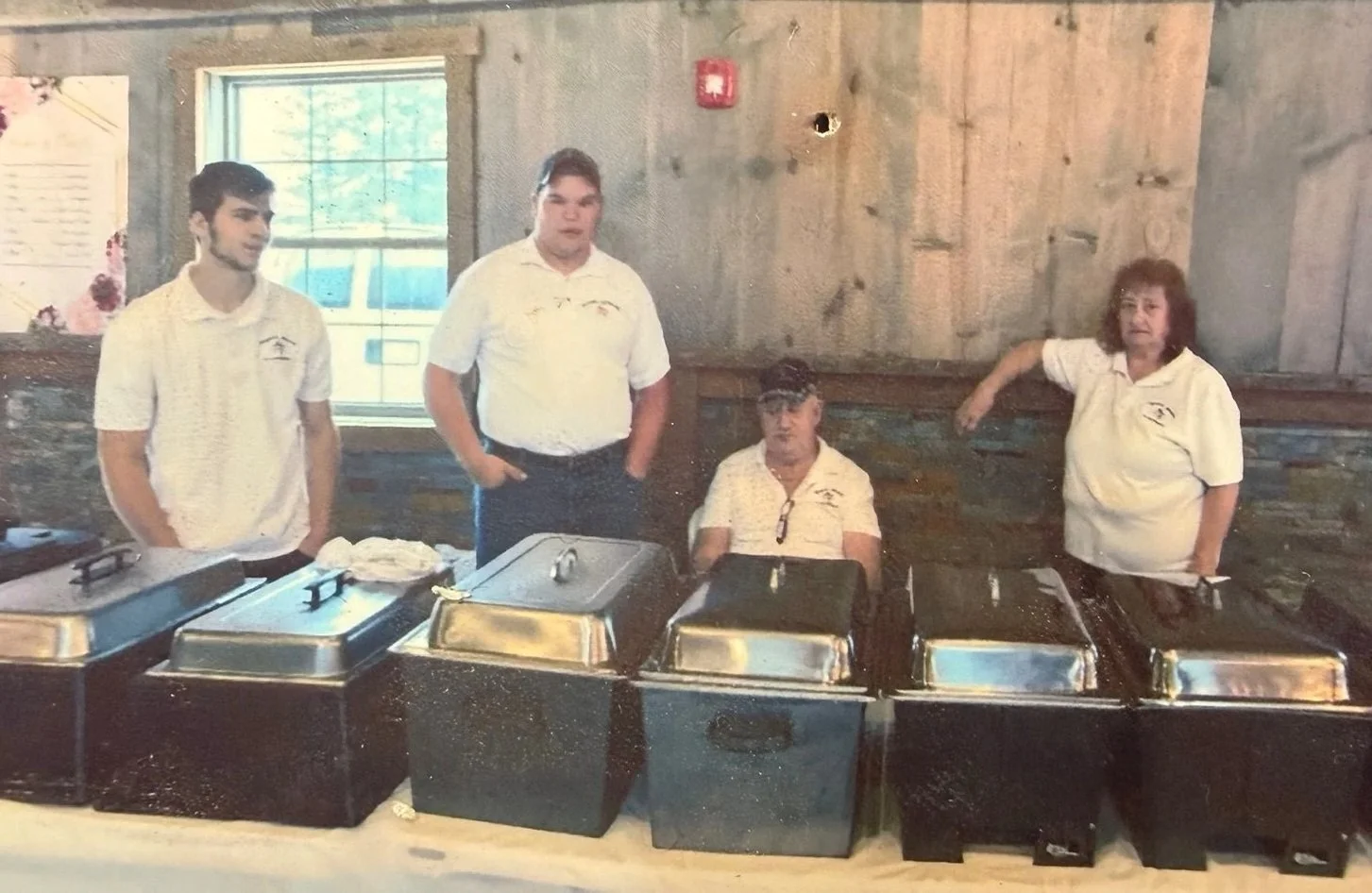 catering wells setup with Craig's meats team standing behind
